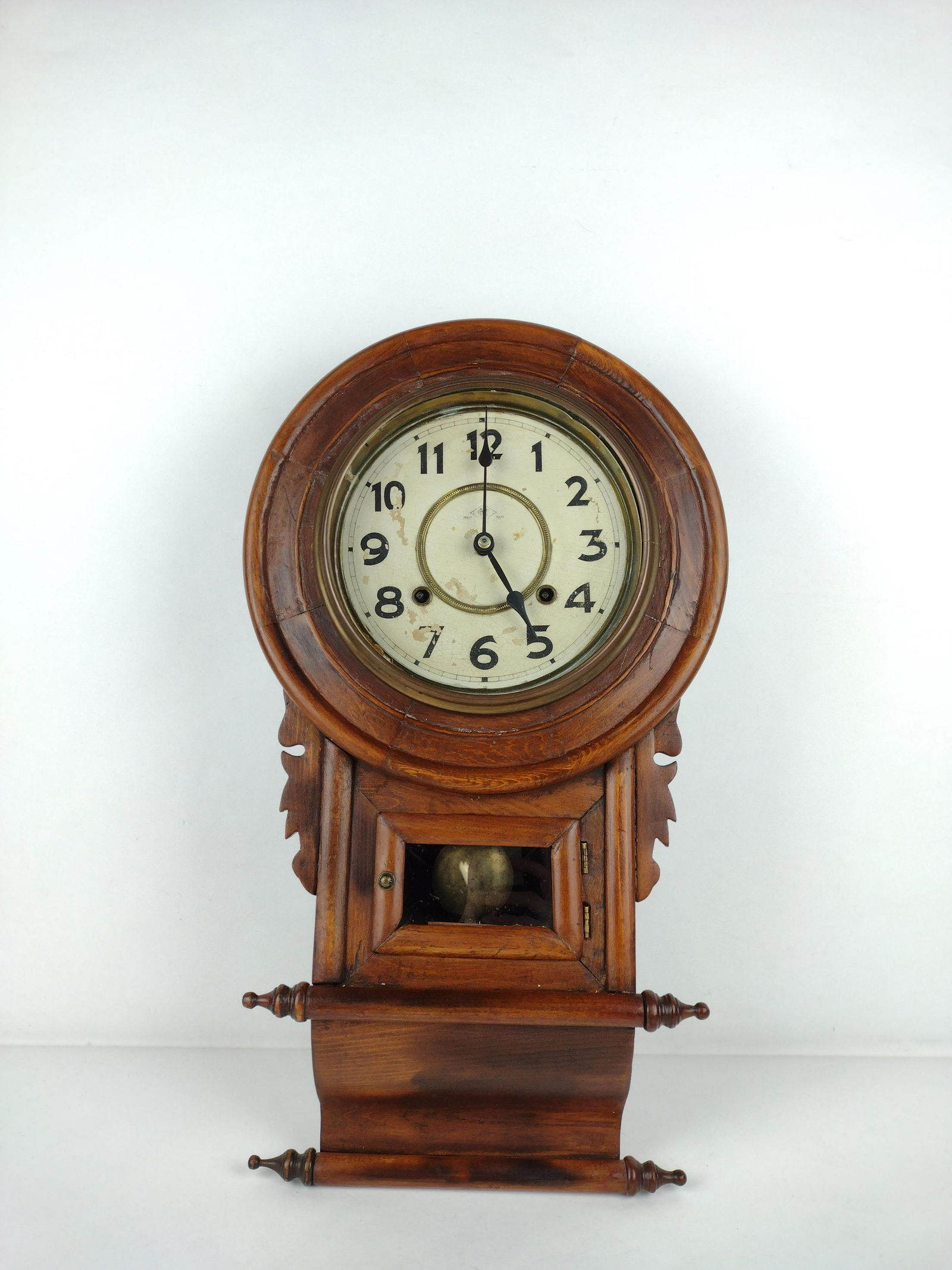 Antique Wall Clock: Painted face with losses and cracking. Castle Meiji trademark stamp to face worn. 22-1/2" high x 12-1/4" wide at widest. Starts and stops. Some wear to wood. Losses to paper face. DP. IMPORTANT: Befor