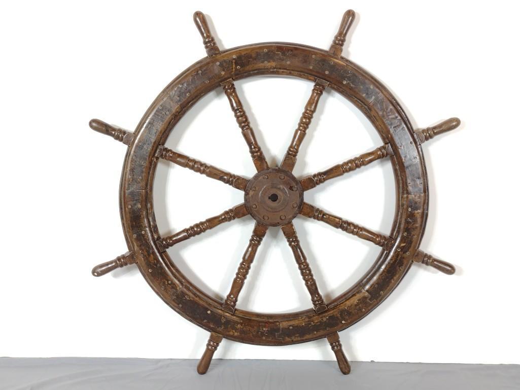 Ships Wheel: 48" diameter X 3" deep. Has orange paint on one side. Has finish loss. MG. IMPORTANT: Before bidding, please read the terms and conditions. When you registered for the auction you agreed to these term