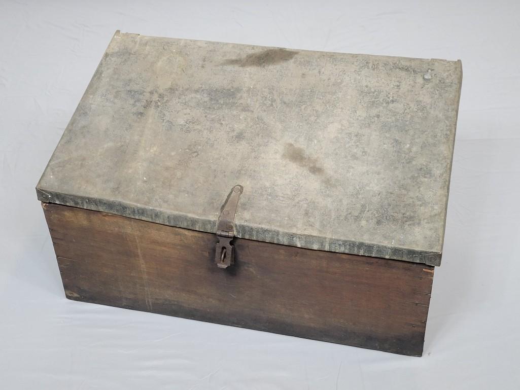 Wood Box with Metal Top: 28 1/2" wide X 16" deep X 16" high. Lid has discoloring. MG. IMPORTANT: Before bidding, please read the terms and conditions. When you registered for the auction you agreed to these terms and will be