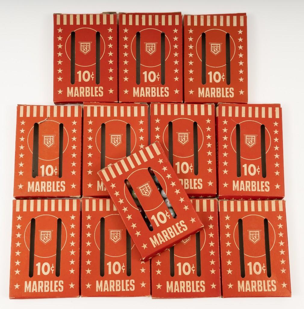 Box of Ravenswood Marbles and 11 Empty Boxes: Some boxes with minor tears. MH IMPORTANT: Before bidding, please read the terms and conditions. When you registered for the auction you agreed to these terms and will be required to comply with them.