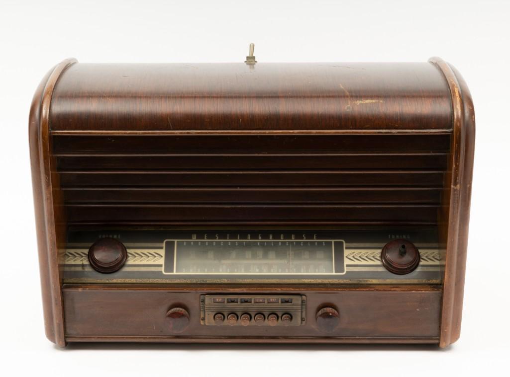 Westinghouse Model H-104 Radio: SN 70048755. No back cover. Powers and tunes. Scratches and nicks to wood housing. 19-1/2" wide x 10-1/2" deep x 12-1/4" high. RM. IMPORTANT: Before bidding, please read the terms and conditions. When