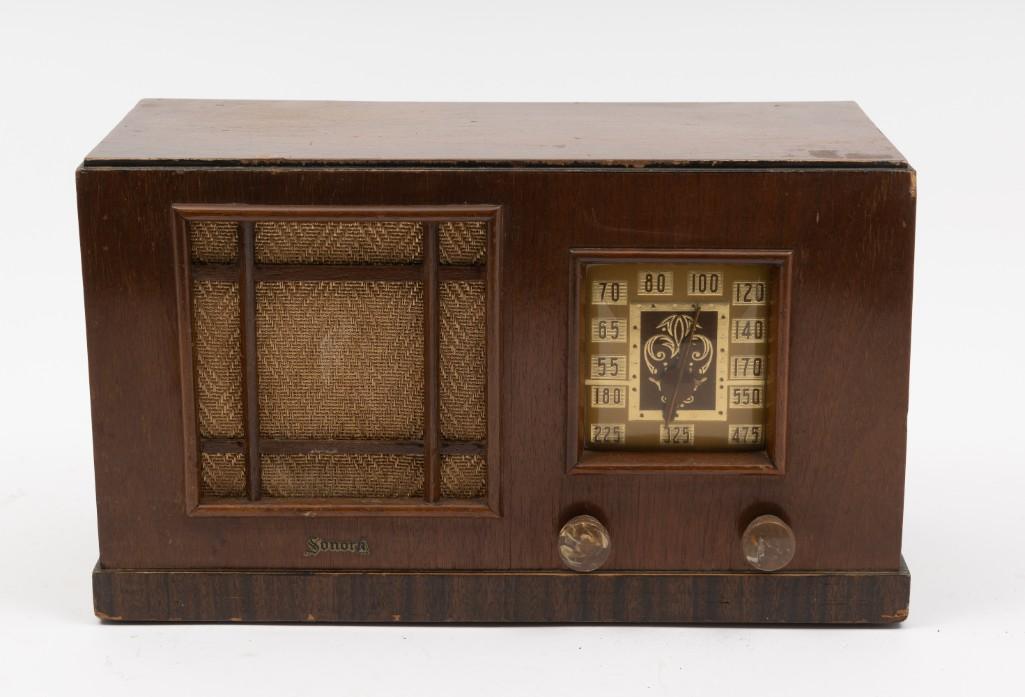 Vintage Sonora Model LLS-179 Radio: Powers on and tunes. Nicks and scratches to wood. 13-1/4" wide x 6" deep x 8" high. RM. IMPORTANT: Before bidding, please read the terms and conditions. When you registered for the auction you agreed 
