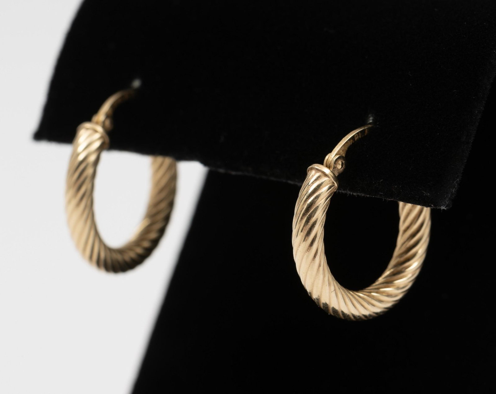 14K Hoop Earrings: 1/2" long. 0.9 dwt. MH. IMPORTANT: Before bidding, please read the terms and conditions. When you registered for the auction you agreed to these terms and will be required to comply with them.