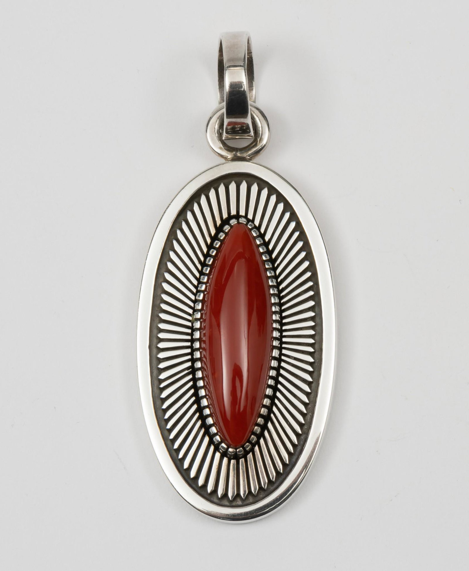 Ernest Bilagody Jr Navajo Sterling & Coral Pendant: 3" long. MH. IMPORTANT: Before bidding, please read the terms and conditions. When you registered for the auction you agreed to these terms and will be required to comply with them.