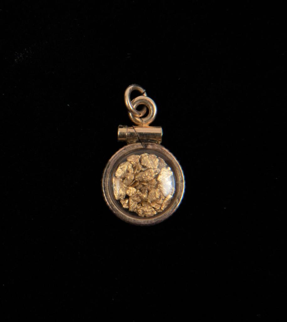 Gold Sample Charm: Case is gold filled. 5/8" long. 0.5 dwt. IMPORTANT: Before bidding, please read the terms and conditions. When you registered for the auction you agreed to these terms and will be required to comply w