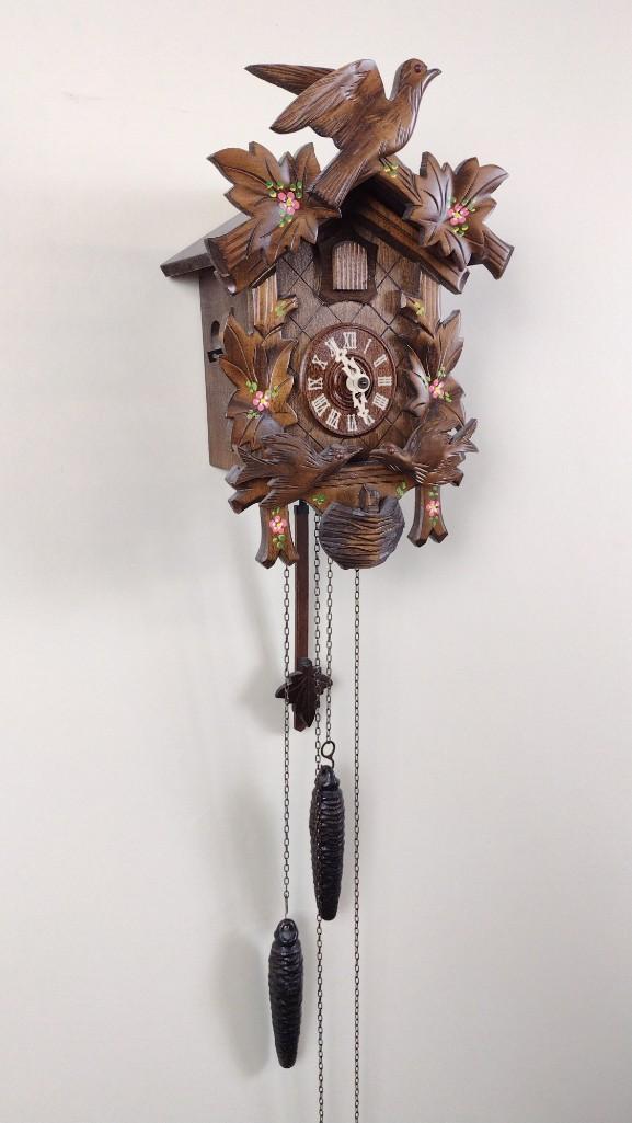Cuckoo Clock: Starts and stops. 8" wide X 6" deep X 11-1/2" high. DM IMPORTANT: Before bidding, please read the terms and conditions. When you registered for the auction you agreed to these terms and will be requir