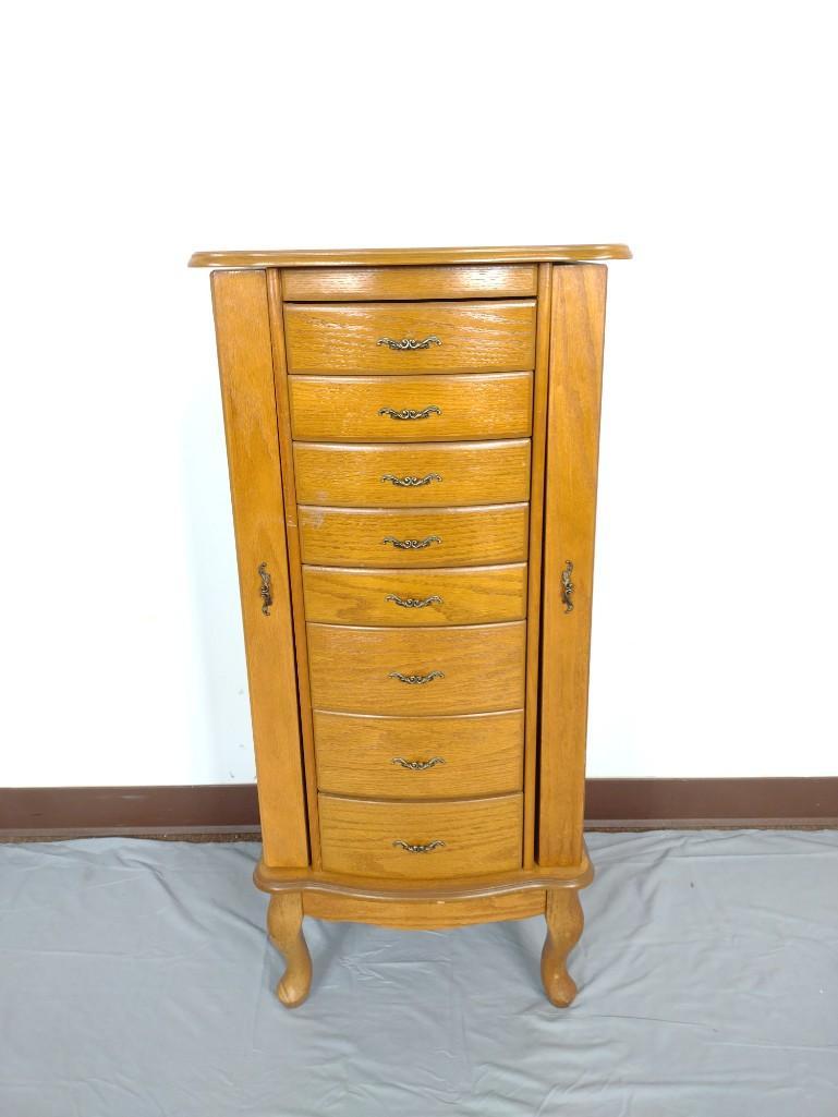 Jewelry Chest: 18" wide X 15" deep X 40 1/2" high. Has areas of finish loss. MG. IMPORTANT: Before bidding, please read the terms and conditions. When you registered for the auction you agreed to these terms and wil