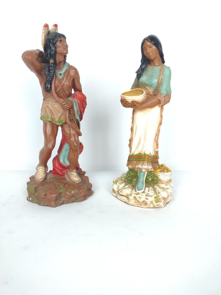 2 Native American Figurines: Signed to back. Male 14-1/2" high x 5-1/2" wide. Female 13-1/2" high x 5" wide. RM IMPORTANT: Before bidding, please read the terms and conditions. When you registered for the auction you agreed to th