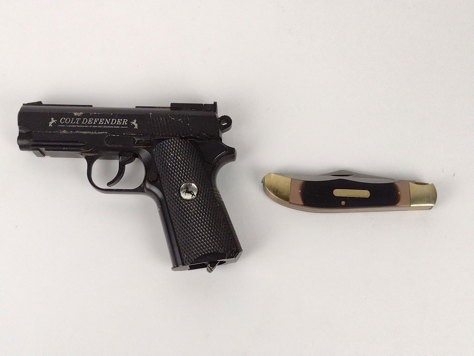 Colt Defender BB Gun & Old Timer Knife: Colt Defender Serial # 13A04500 .177 Cal. Old Timer knife with sheath. Model # 2250T. Colt 6-1/2" wide. Knife 9-1/4" long extended. DP IMPORTANT: Before bidding, please read the terms and conditions.