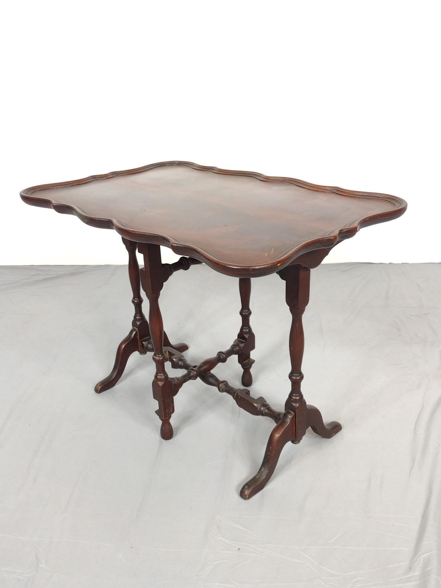 Tilt Top Side Table: 25 1/2" wide X 17" deep X 19' high. Has scratches to the top. MG IMPORTANT: Before bidding, please read the terms and conditions. When you registered for the auction you agreed to these terms and will