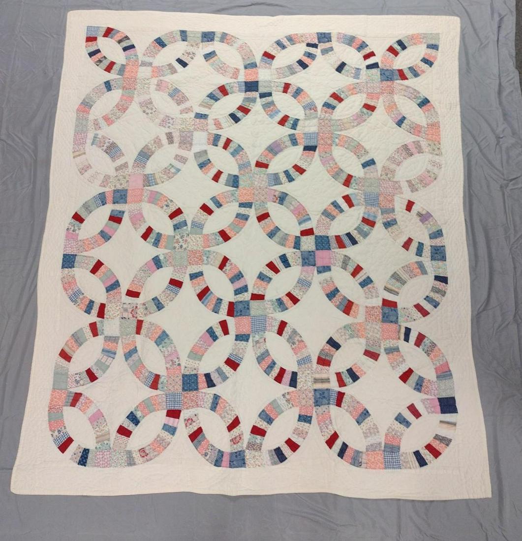 Wedding Ring Quilt: 6'2" wide X 7' long. DM IMPORTANT: Before bidding, please read the terms and conditions. When you registered for the auction you agreed to these terms and will be required to comply with them.