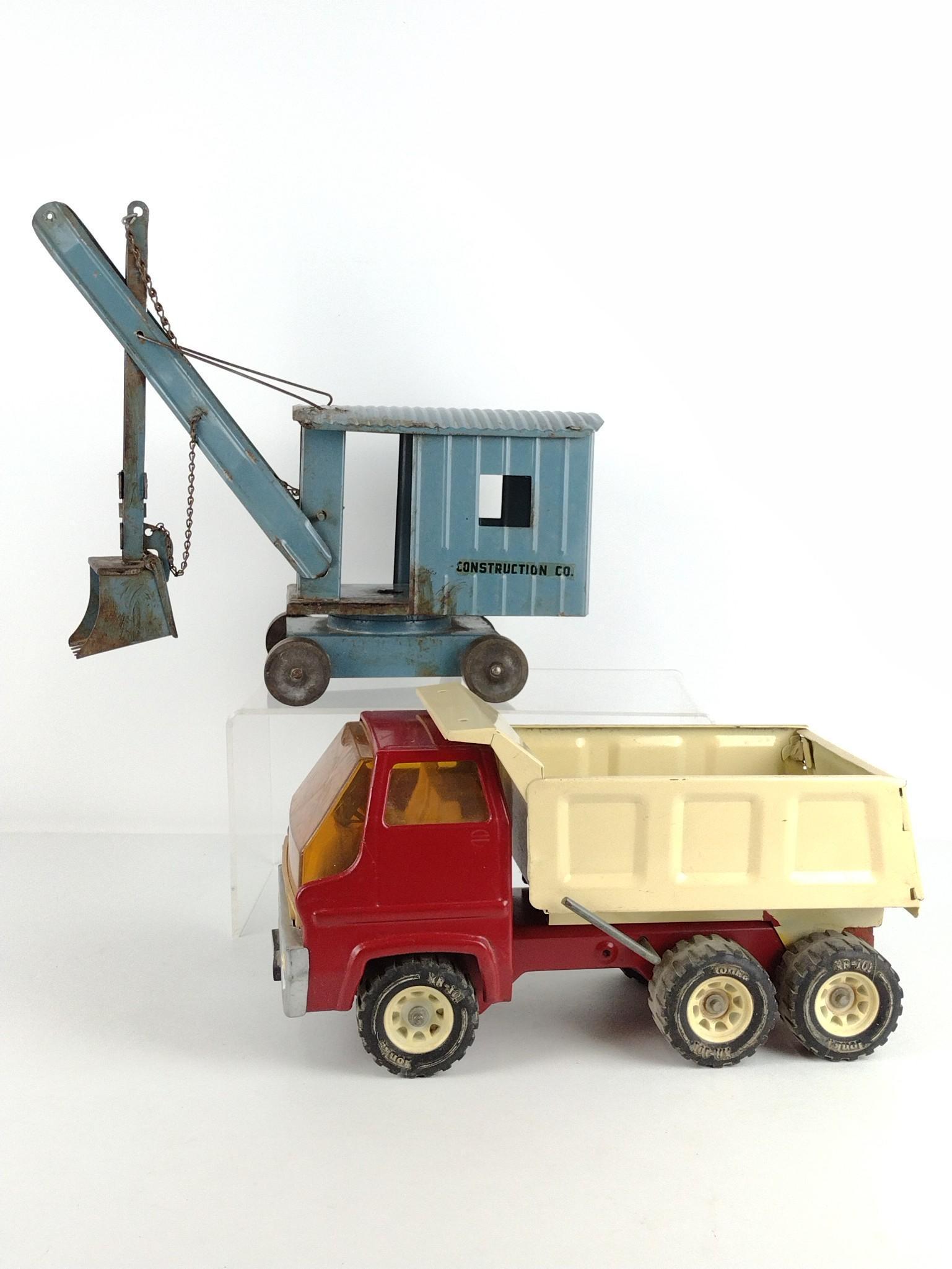 Pressed Steel Crane & Tonka Dump Truck: Crane unmarked. Truck 7" high x 13-1/2" long. Crane 12" high x 14" long. DP. IMPORTANT: Before bidding, please read the terms and conditions. When you registered for the auction you agreed to these te