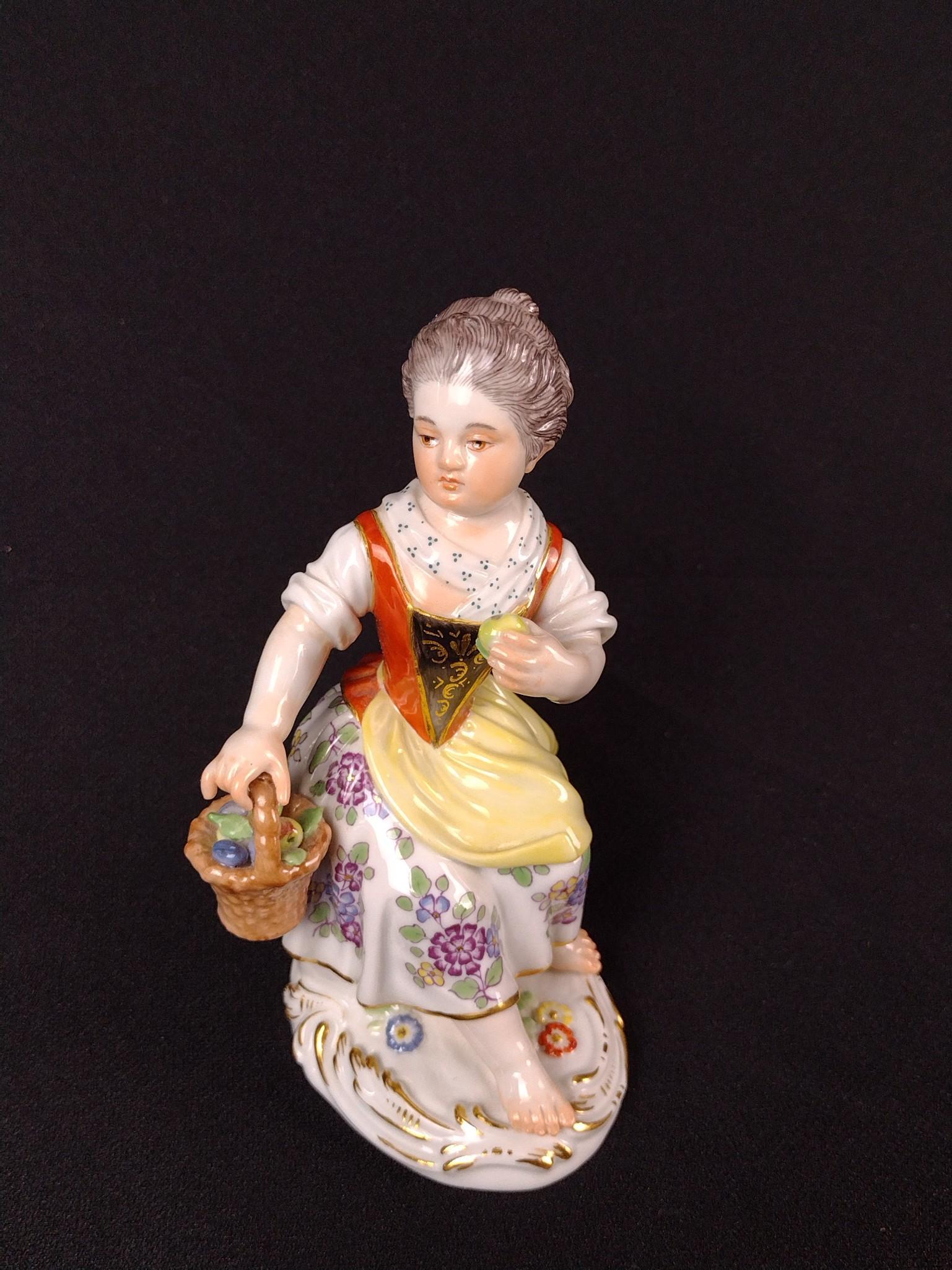 Meissen Girl with Apple Figurine: 2-1/2" wide X 2-1/4" deep X 5" high. LR IMPORTANT: Before bidding, please read the terms and conditions. When you registered for the auction you agreed to these terms and will be required to comply wi