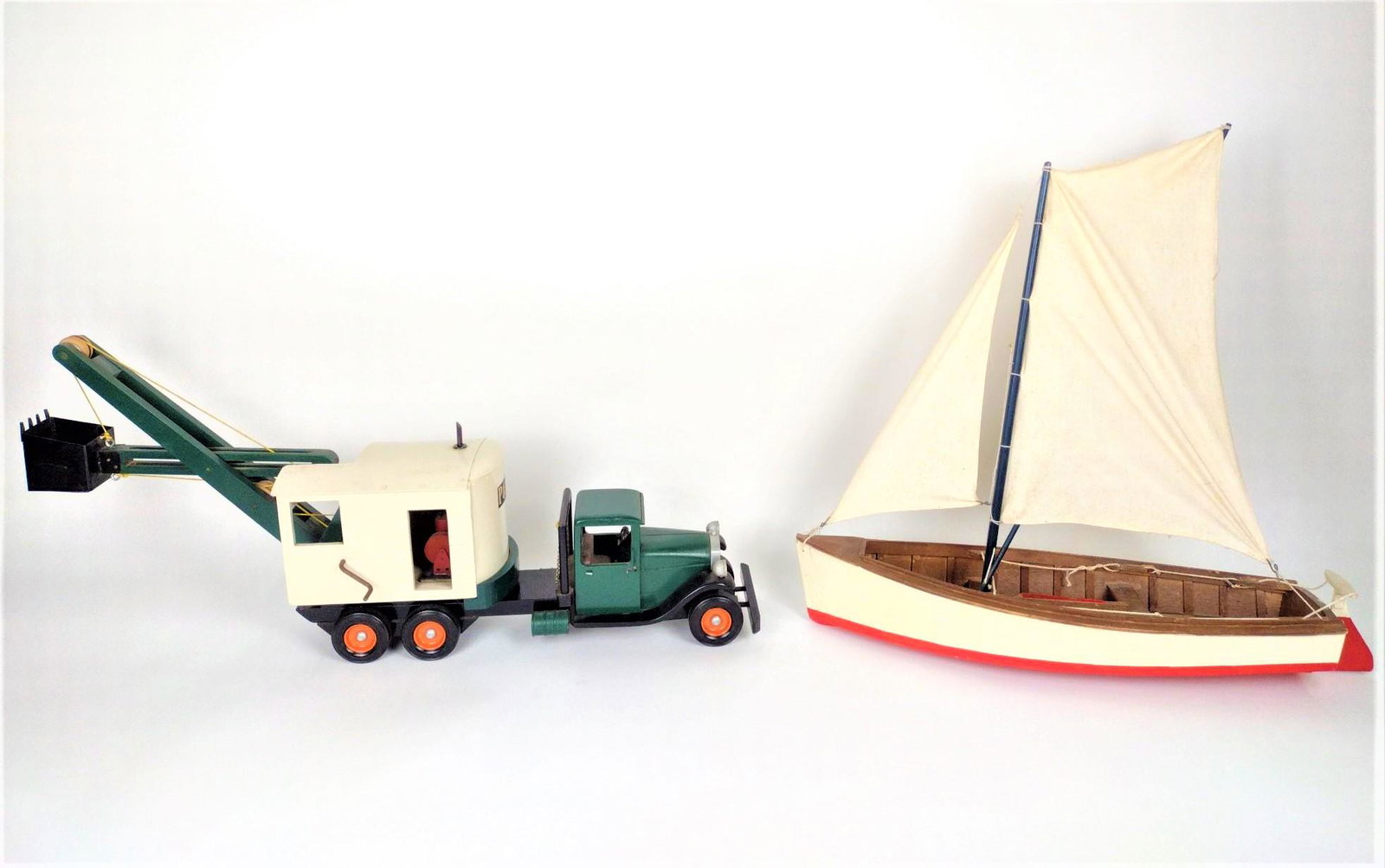Scratch Built Sail Boat and Truck: Truck made of wood and metal. Sail boat made of wood and cloth. 25" to 31" long X 14-1/2" to 25" high. LR IMPORTANT: Before bidding, please read the terms and conditions. When you registered for the a