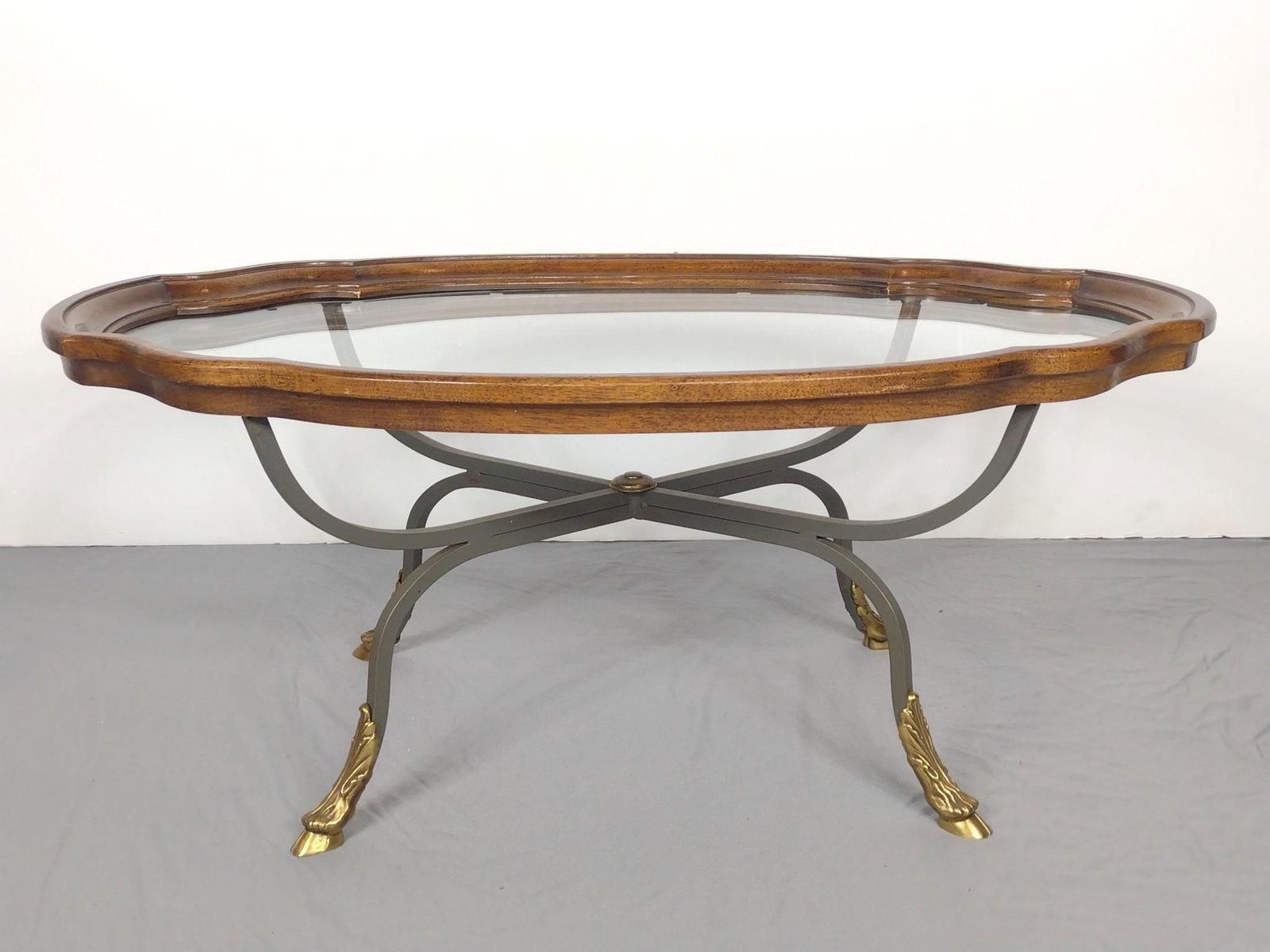 Glass Top Coffee Table with Hoof Feet: 39" wide X 24" deep X 16-1/4" high. MG IMPORTANT: Before bidding, please read the terms and conditions. When you registered for the auction you agreed to these terms and will be required to comply wit