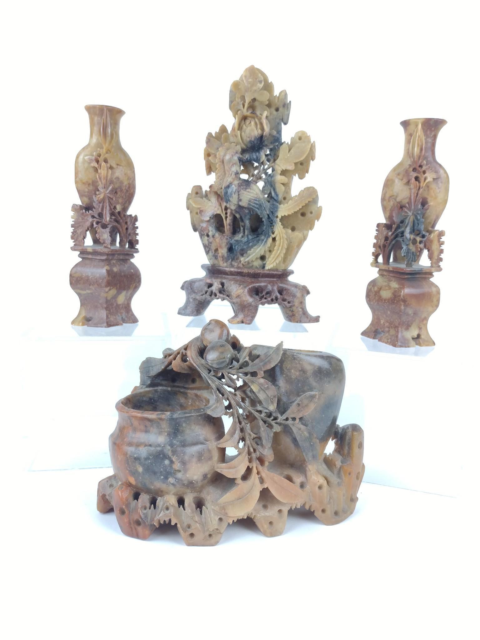 4 Soapstone Carvings Incl Cabinet Vases: 2" to 6 1/2" wide x 4 1/2" to 6" high. Some with chips and loss. JK IMPORTANT: Before bidding, please read the terms and conditions. When you registered for the auction you agreed to these terms and w