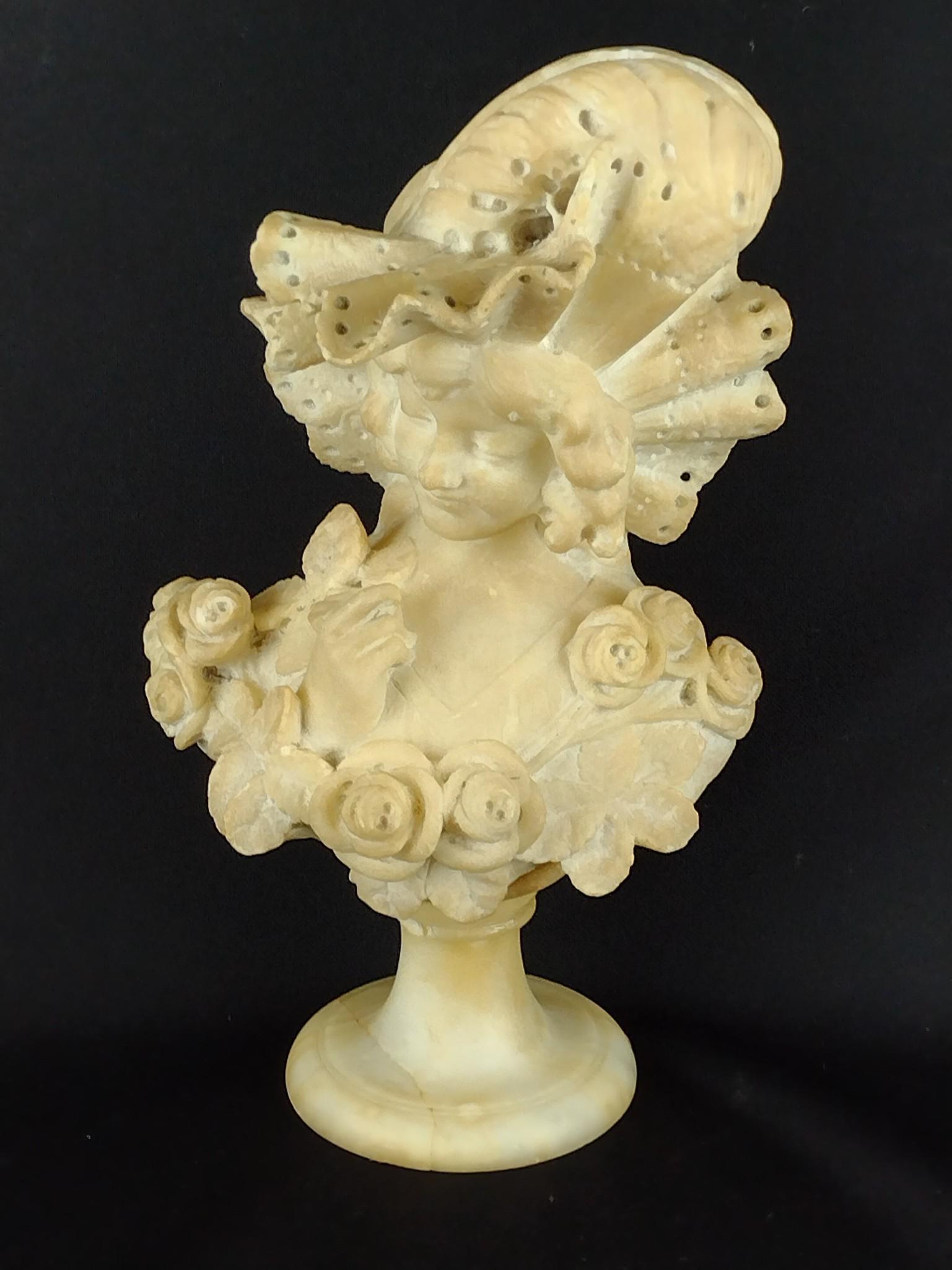 Alabaster Bust: Unsigned. 11-1/2" high x 5-1/2" deep x 6-1/2" wide. Repairs to back and base and 3/4" loss to base. KE. IMPORTANT: Before bidding, please read the terms and conditions. When you registered for the auc