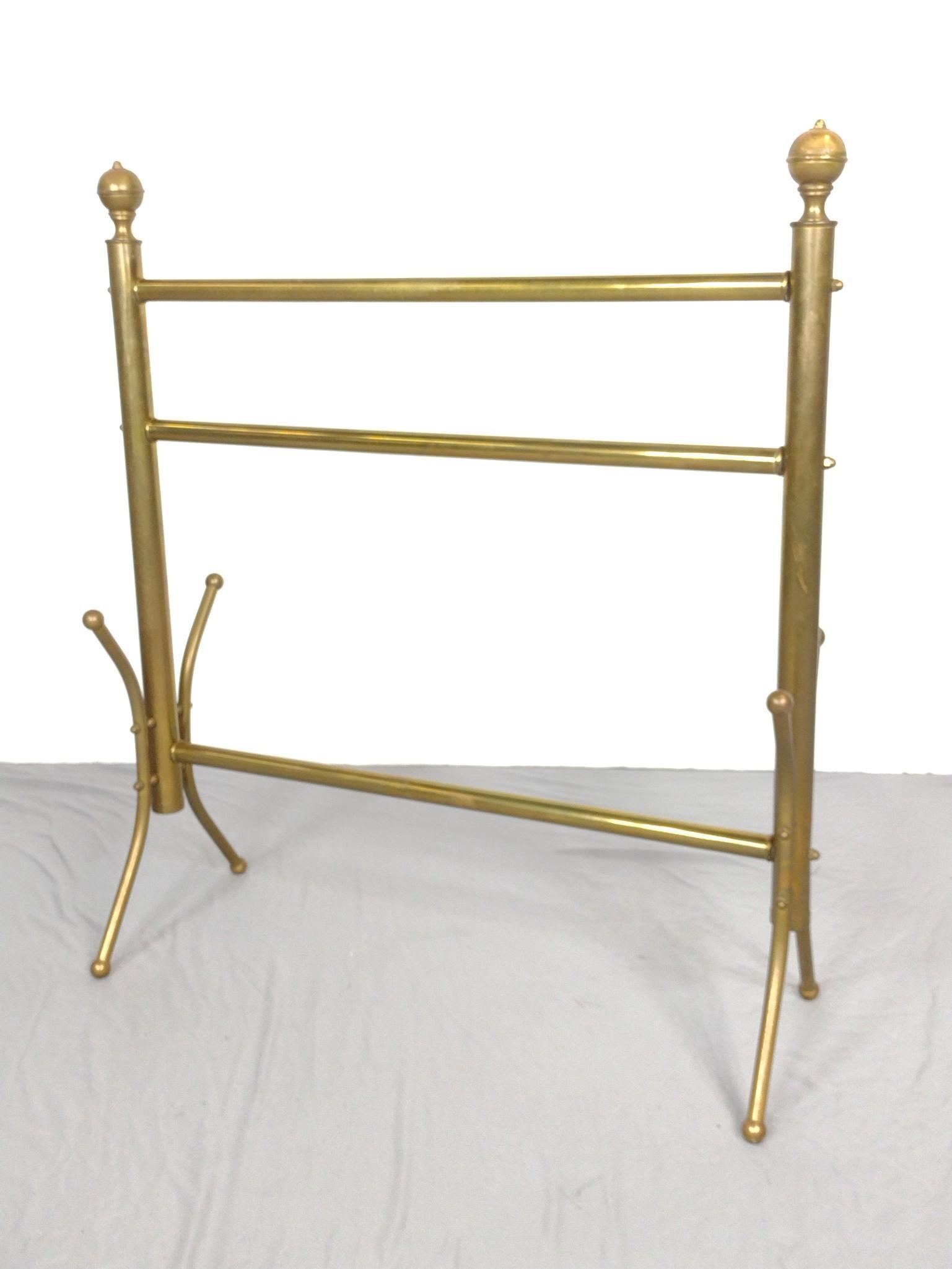 Brass Quilt Rack: 31" wide X 11-1/2" deep X 35" high. Has some discoloring. MG. IMPORTANT: Before bidding, please read the terms and conditions. When you registered for the auction you agreed to these terms and will be