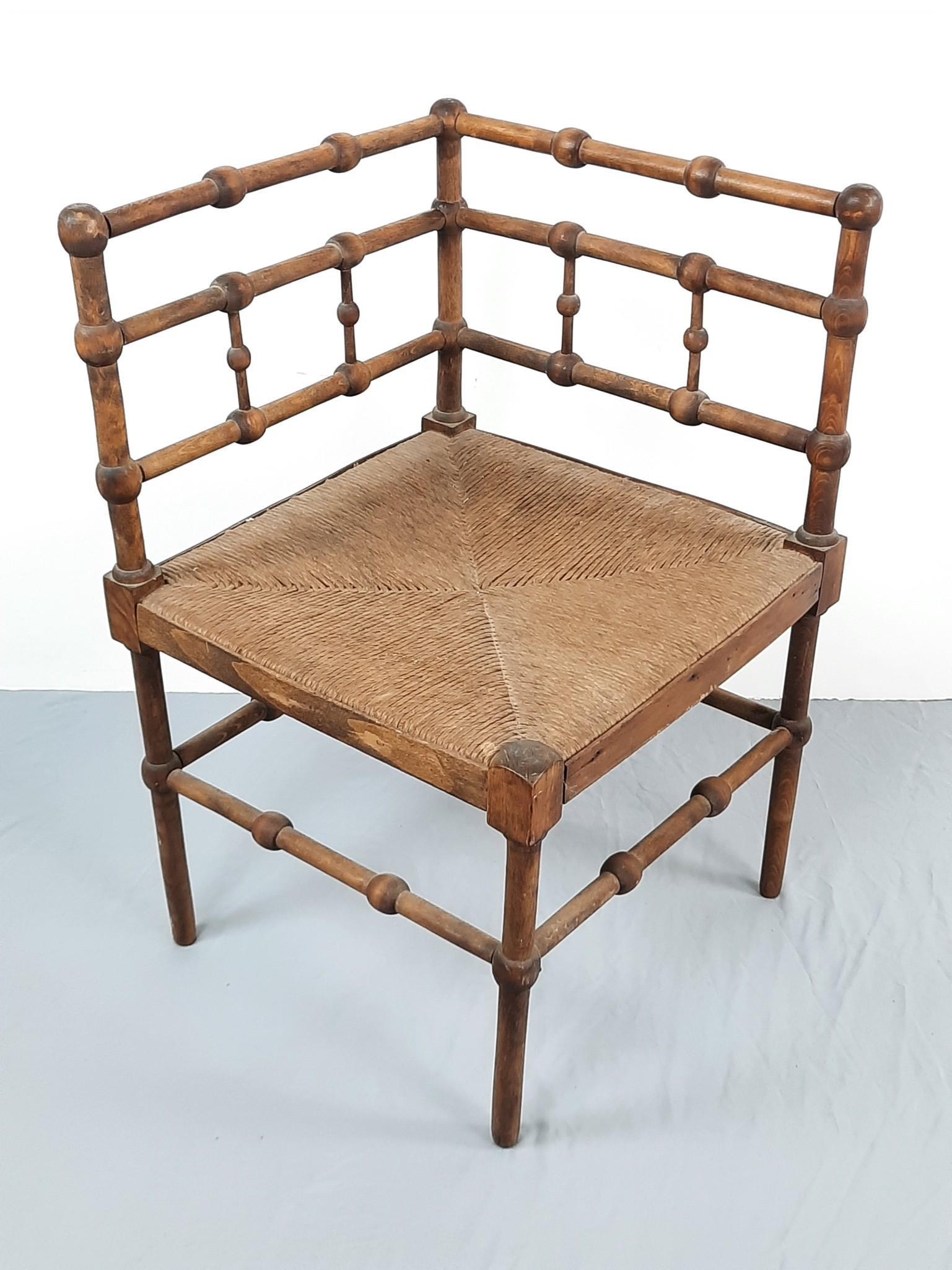 Antique Corner Chair with Rush Seat: 16-1/2" wide x 16-1/2" deep x 26" high. Repair and loss to back corner leg. LR IMPORTANT: Before bidding, please read the terms and conditions. When you registered for the auction you agreed to these