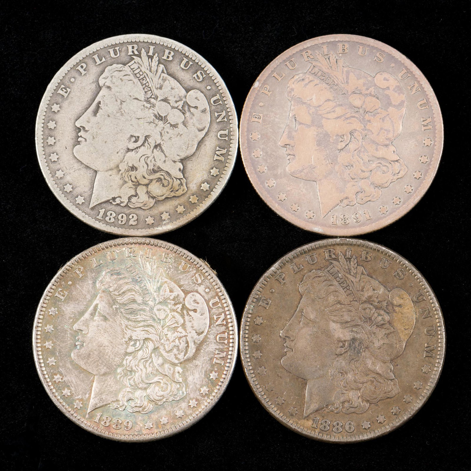 4 Morgan Silver Dollars Incl 1886 (1 of 2)