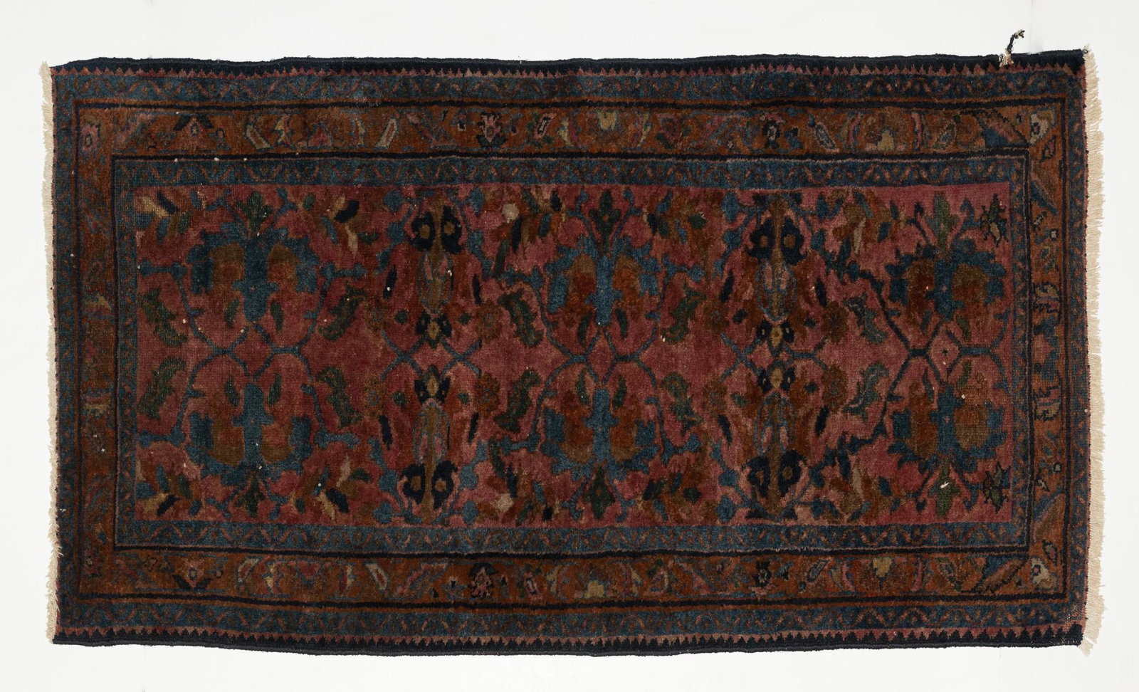 Persian Lilihan Area Rug: DESCRIPTION: Persian Lilihan area rug. Abstract, all-over design set in a dark magenta field with blue and brown highlights. 1930s. MEASUREMENTS: 4' 10" long x 2' 8" wide. CONDITION: Binding slightly 