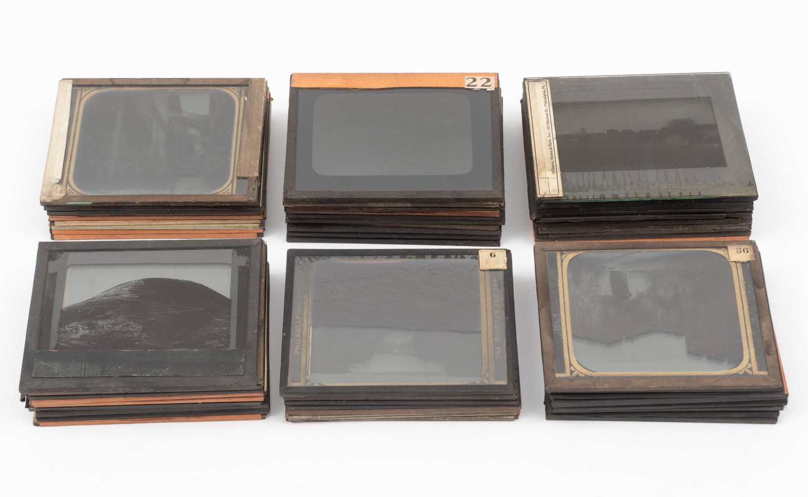 51 Magic Lantern Slides: DESCRIPTION: Fifty-one Magic Lantern slides. All unlabeled. Most depict scenes of the Middle East and Africa. MEASUREMENTS: 4" high x 3-1/4" wide. CONDITION: Some areas of edge paper missing or lose.