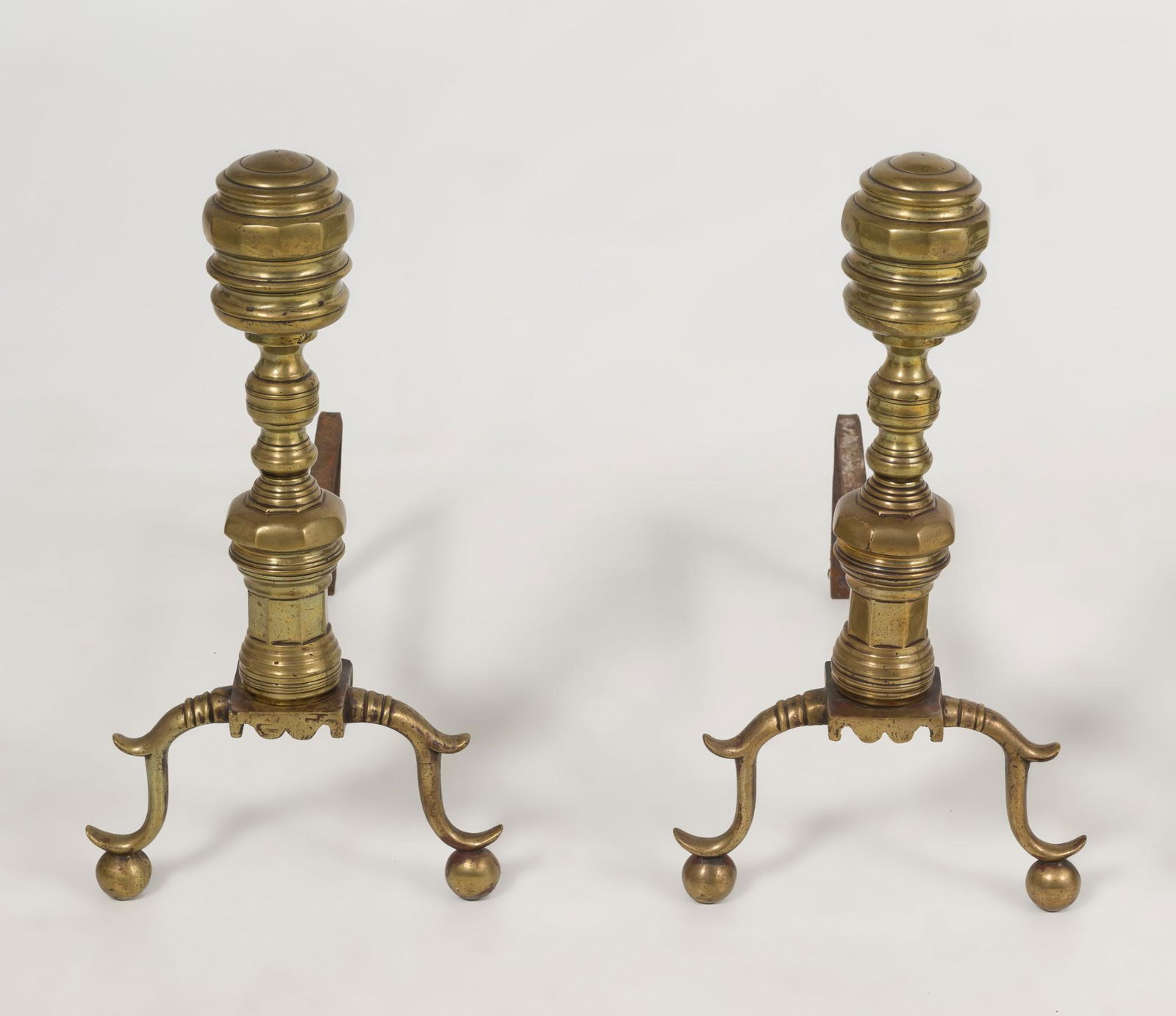 Pair Brass Beehive Andirons: DESCRIPTION: Pair of brass beehive andirons. First half of the 19th century. With curved legs and ball feet. Billet bar dips near front. Unmarked. MEASUREMENTS: 21" high x 20-1/2" deep x 11" wide. CON