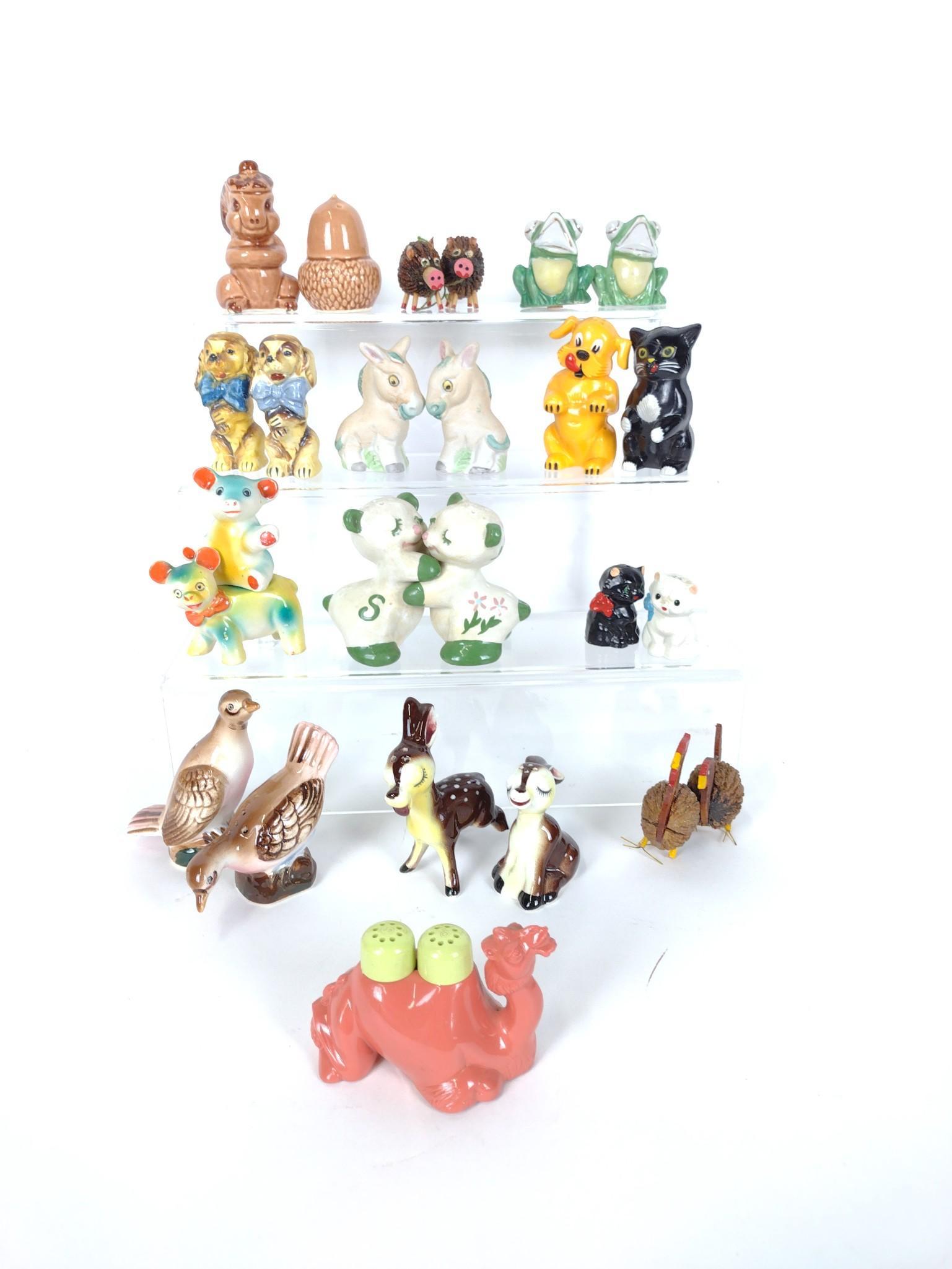 13 Animal Salt & Pepper Sets Incl Camel: 1-3/4" high to 3-3/4" high. One deer with broken leg. One walnut chicken with broken leg. RM IMPORTANT: Before bidding, please read the terms and conditions. When you registered for the auction you ag