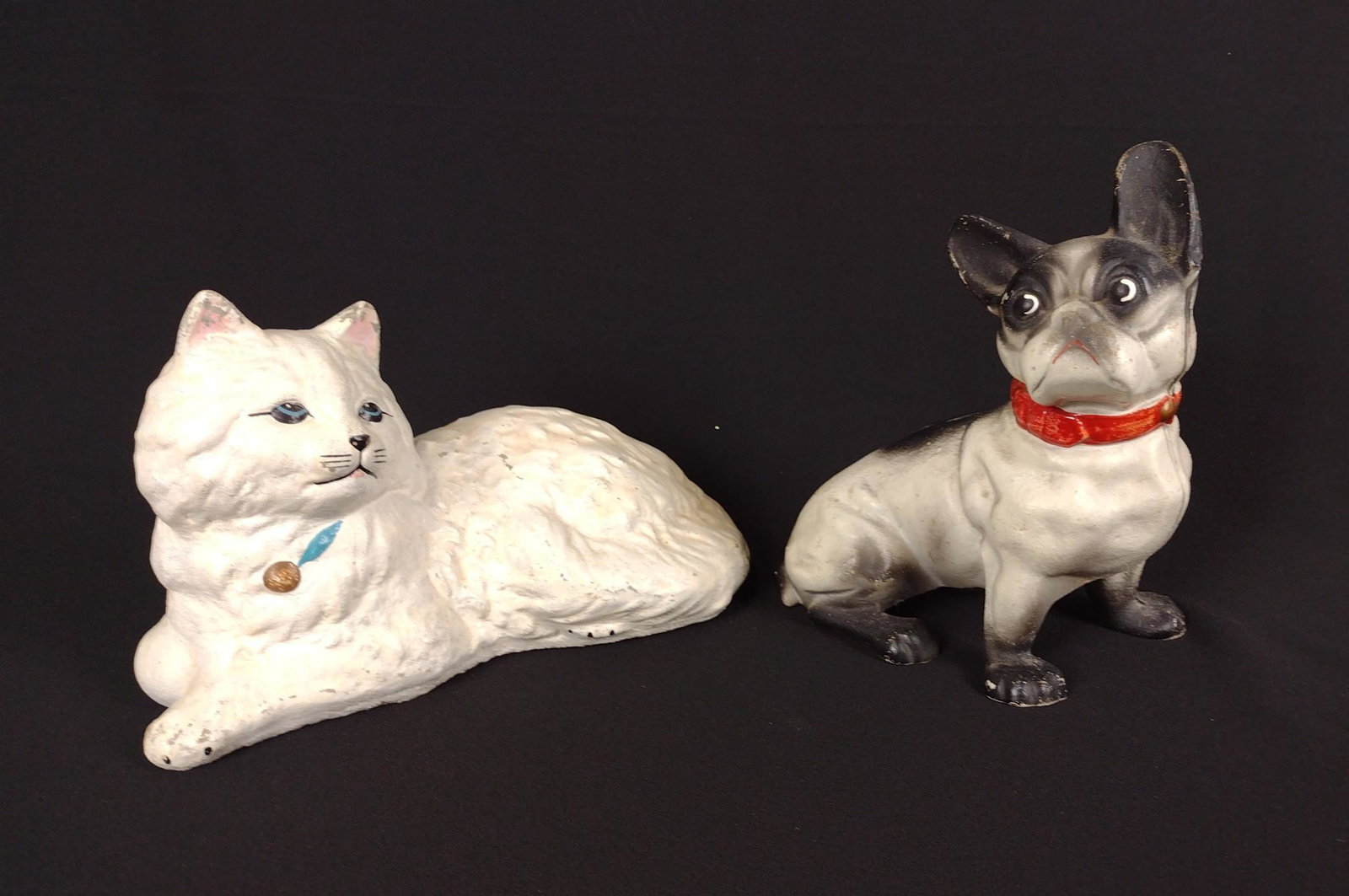 Concrete Cat Door Stop & Cast Iron Dog Bank: 7" to 10-1/2" long and 6" to 7-3/4" high. RM IMPORTANT: Before bidding, please read the terms and conditions. When you registered for the auction you agreed to these terms and will be required to comp