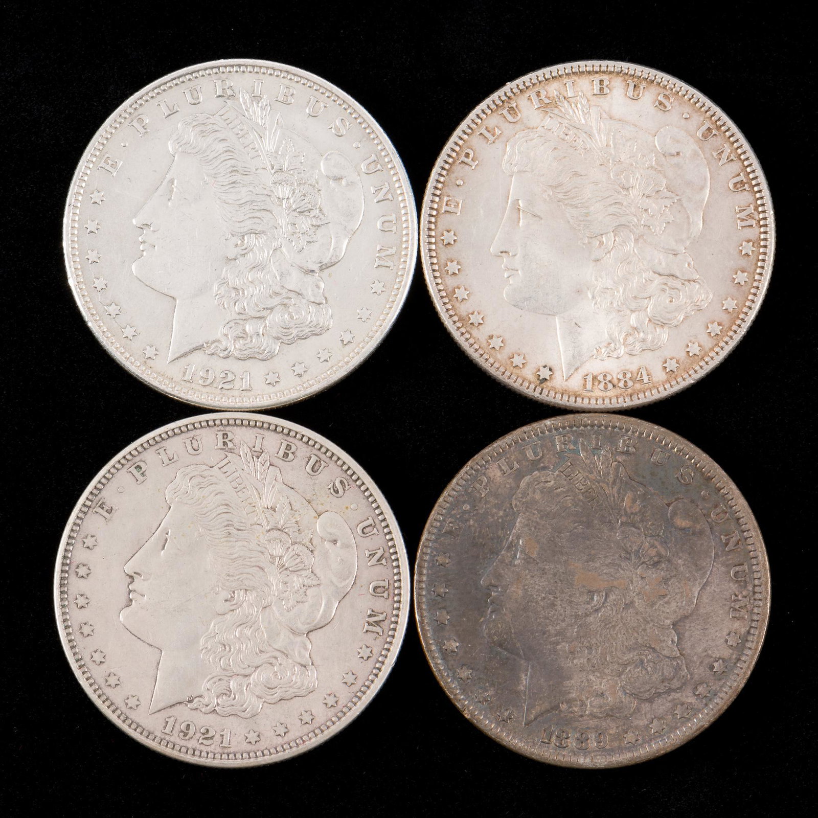 4 Morgan Silver Dollars Incl 1884 (1 of 2)