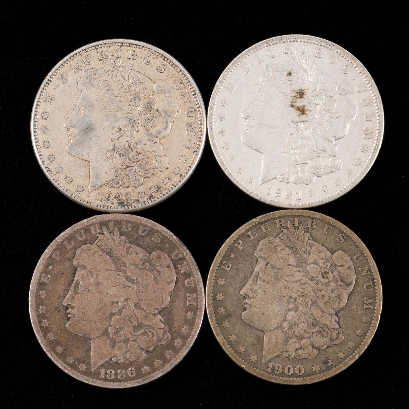 4 Morgan Silver Dollars Incl 1886 (1 of 2)