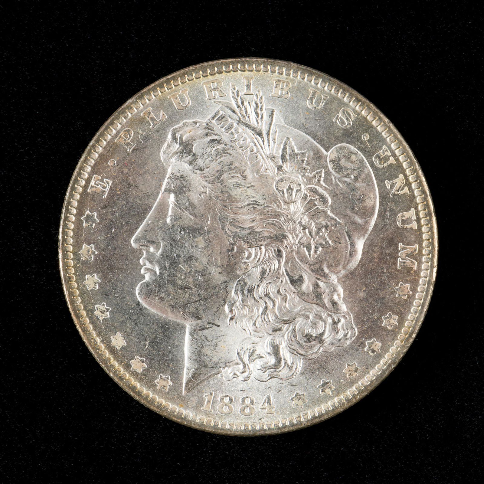 1884-O Morgan Silver Dollar: Choice uncirculated. KE. IMPORTANT: Before bidding, please read the terms and conditions. When you registered for the auction you agreed to these terms and will be required to comply with them.