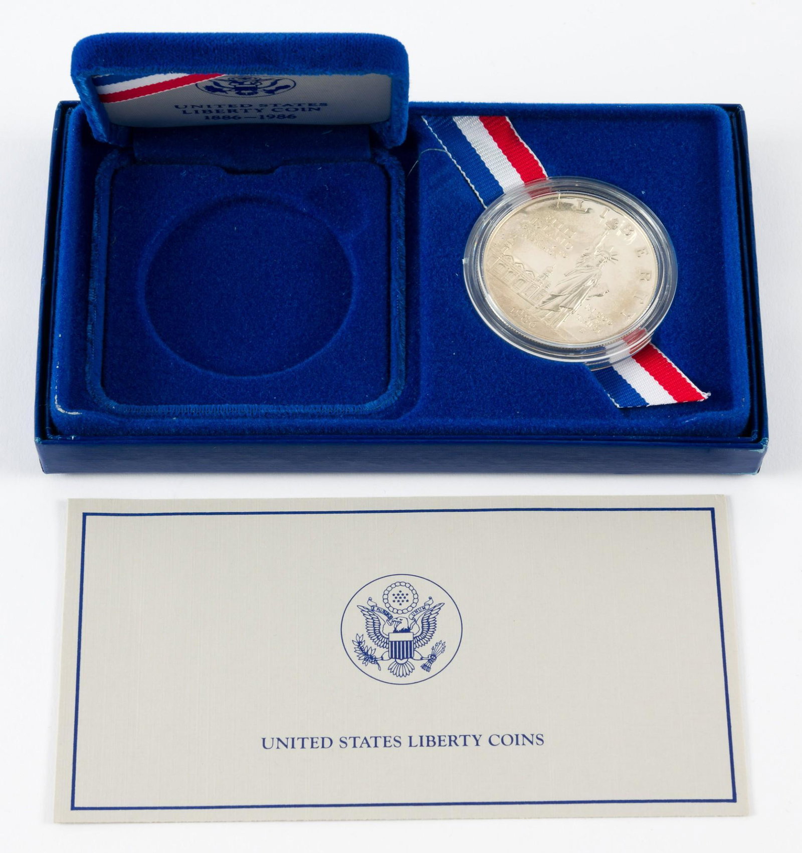 1986 Commemorative Statue of Liberty Silver Dollar: Includes box and certificate of authenticity. Proof. KE. IMPORTANT: Before bidding, please read the terms and conditions. When you registered for the auction you agreed to these terms and will be requ
