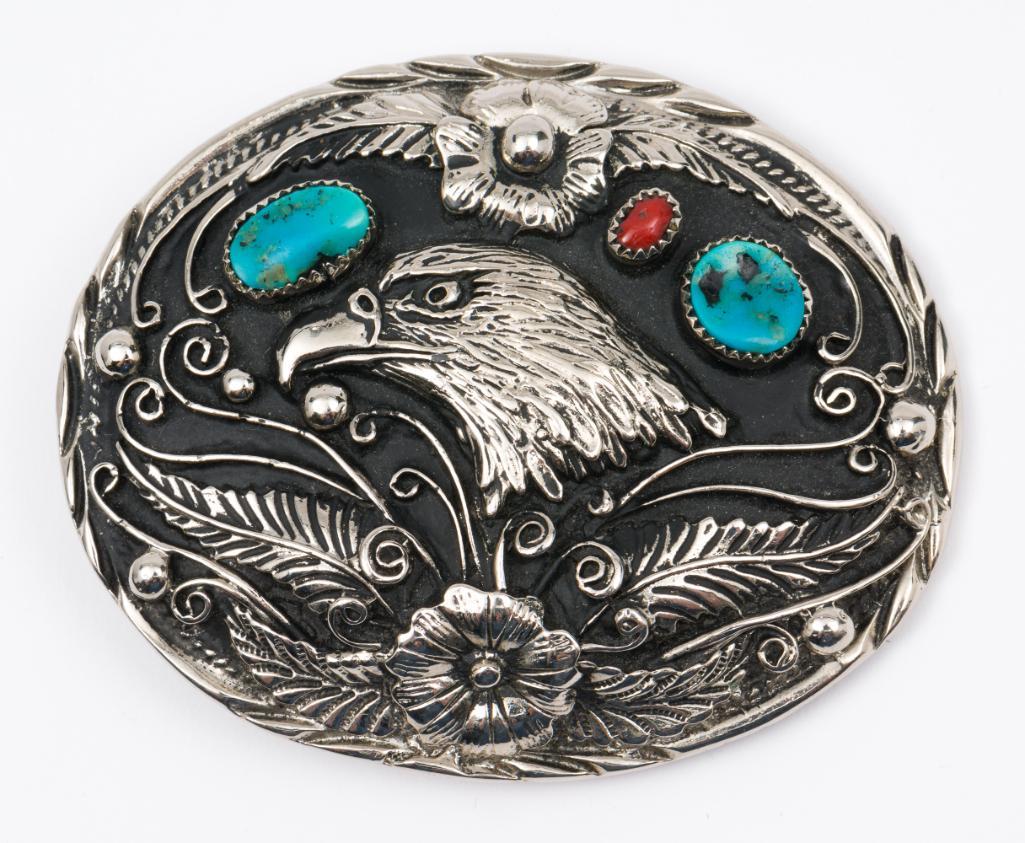 Native American S.S.I. Silver Belt Buckle: With turquoise and coral. Stamped Handcrafted U.S.A. Signed S.S.I. 3" high x 3-1/4" wide. MH/EK. IMPORTANT: Before bidding, please read the terms and conditions. When you registered for the auction yo