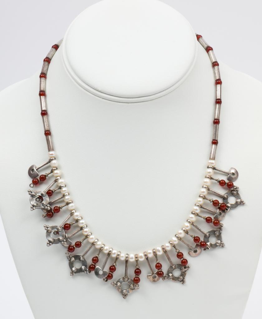 Sterling, Pearl & Carnelian Bead Necklace: 18" long x 1-1/8" wide. 5 mm pearl beads and 4 mm carnelian beads. Stamped with maker's mark. MH/EK. IMPORTANT: Before bidding, please read the terms and conditions. When you registered for the auctio