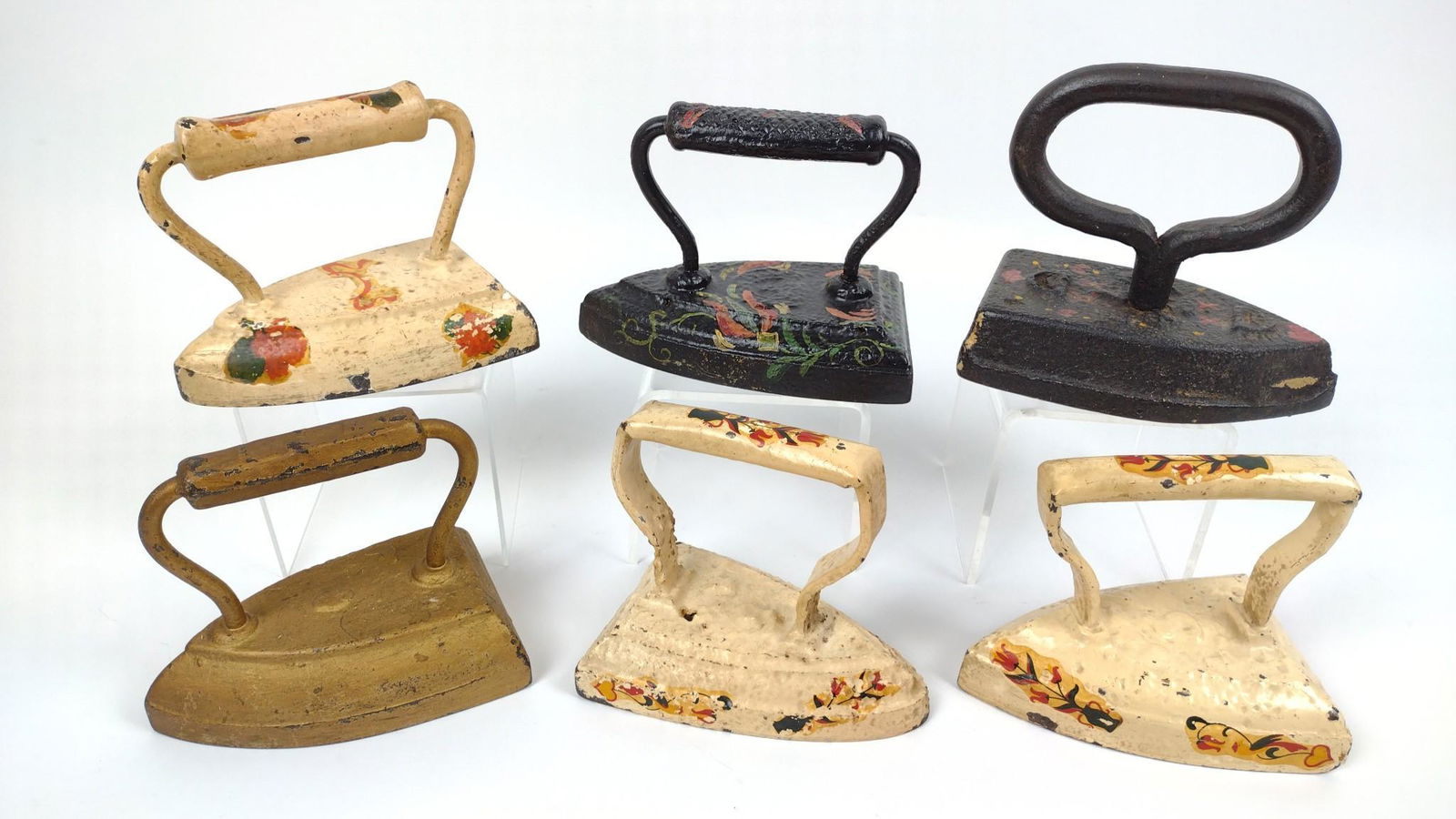 6 Antique Painted Irons: 5-3/4" to 6-1/4" wide X 4-1/2" to 5-1/2" DM IMPORTANT: Before bidding, please read the terms and conditions. When you registered for the auction you agreed to these terms and will be required to compl