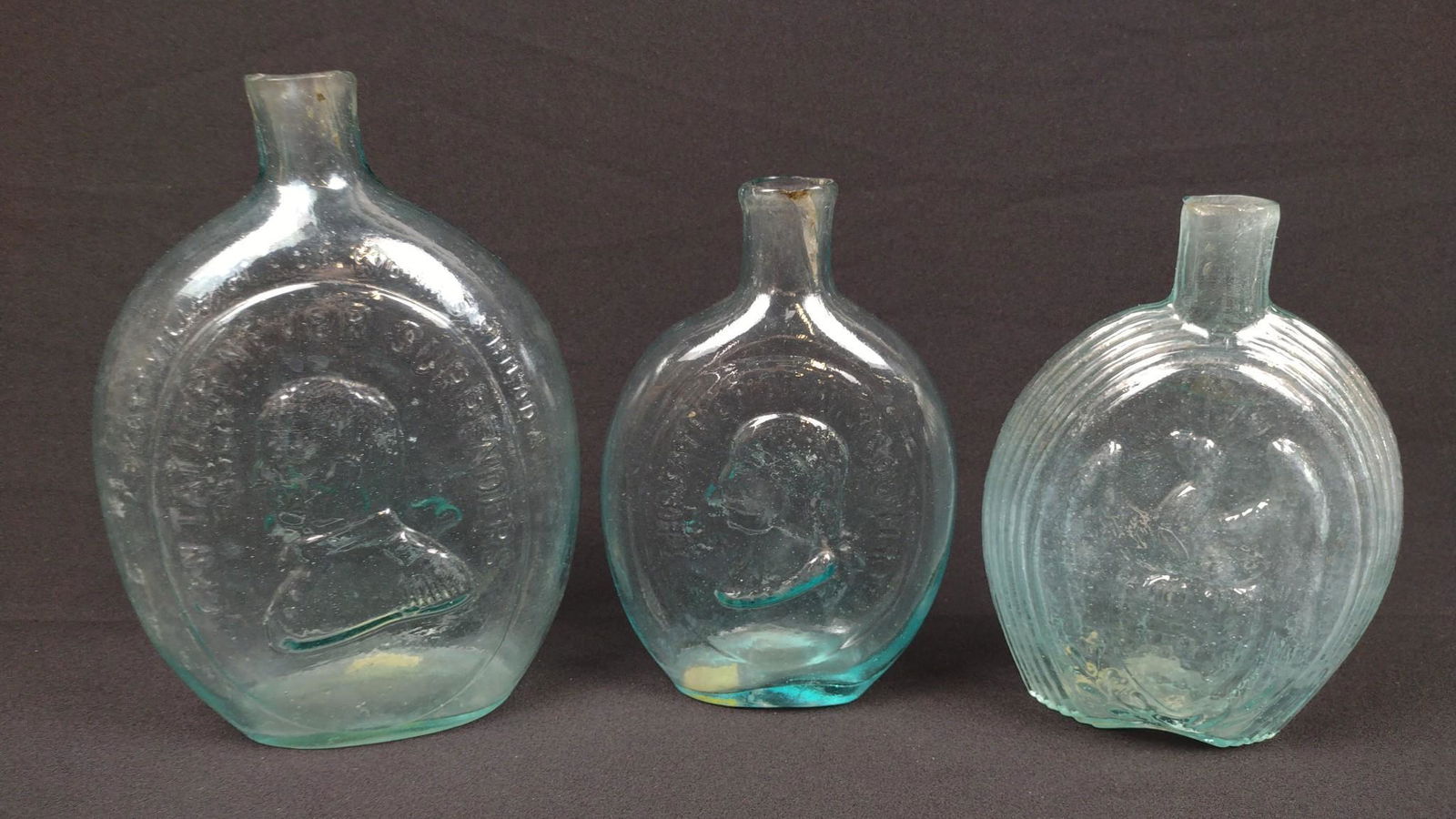 3 Father of Our Country Blown Flasks: Includes Dyottville Glass Works. Phila. 4-3/4" to 5-3/4" wide X 7" to 8" high. DM