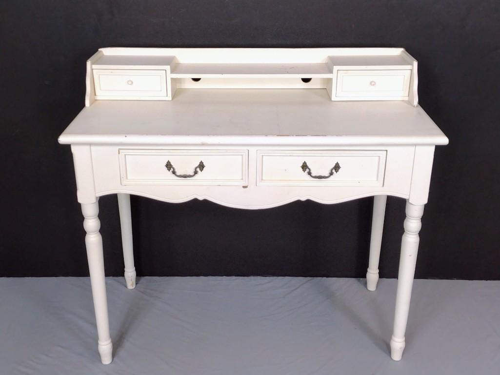 White Desk: 39" wide X 19" deep X 35" high. Has scratches and finish loss. Also has areas of discoloring. MG. IMPORTANT: Before bidding, please read the terms and conditions. When you registered for the auction y