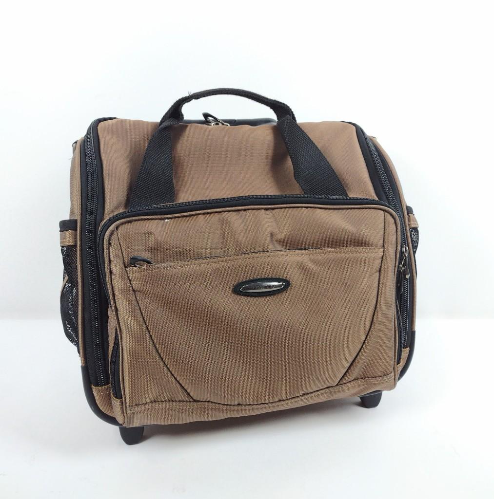 Briggs & Riley Cabin Bag with Wheels: 14" high x 15-1/2" wide x 9" deep. RM IMPORTANT: Before bidding, please read the terms and conditions. When you registered for the auction you agreed to these terms and will be required to comply with