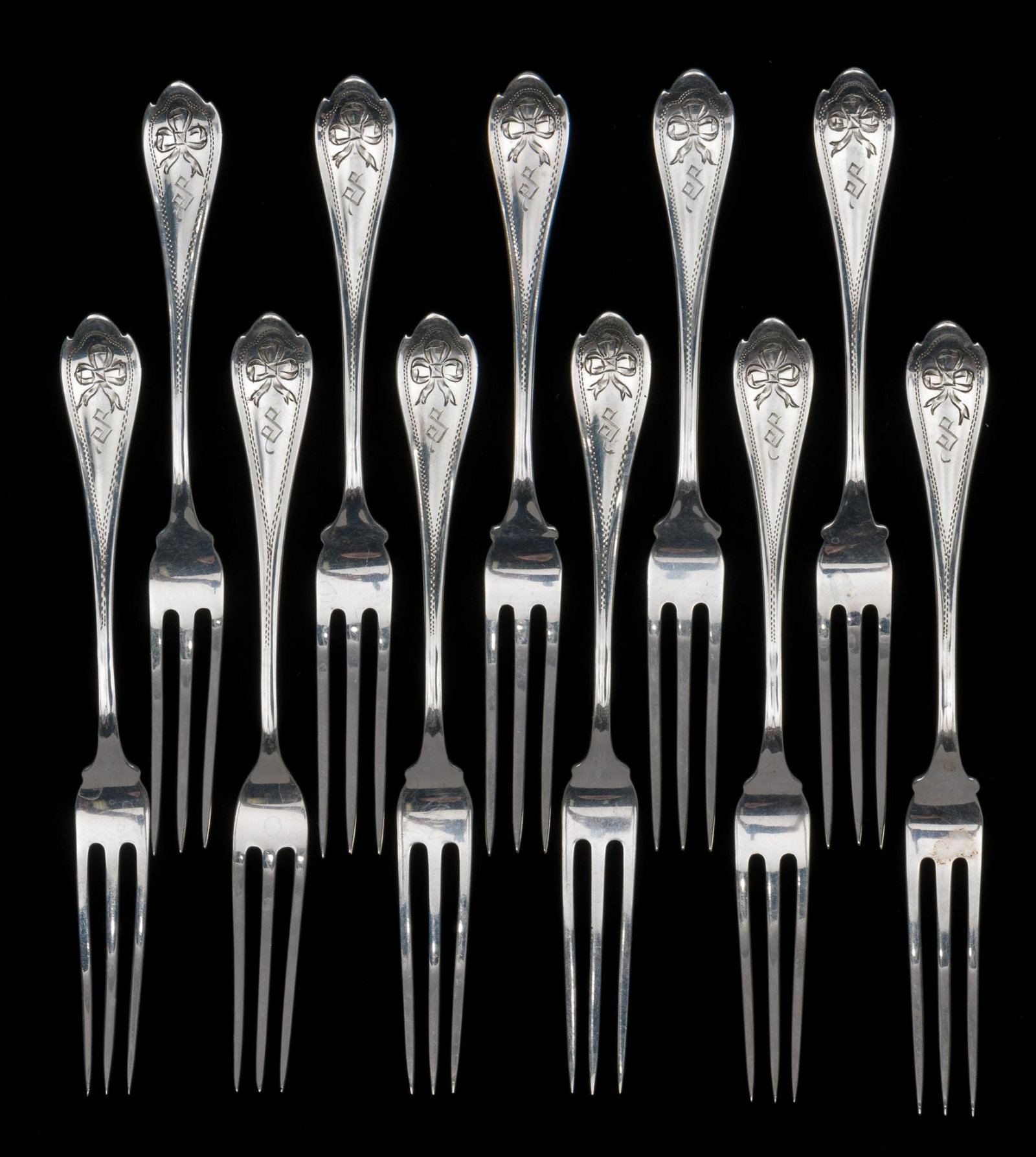 11 Unger Bros. Sterling Strawberry Forks: Eleven Unger Bros. sterling strawberry forks. Engraved No 1 pattern, 1900. Monogrammed. 4-3/4" long. 3.3 troy ounces. KE. IMPORTANT: Before bidding, please read the terms and conditions. When you regi