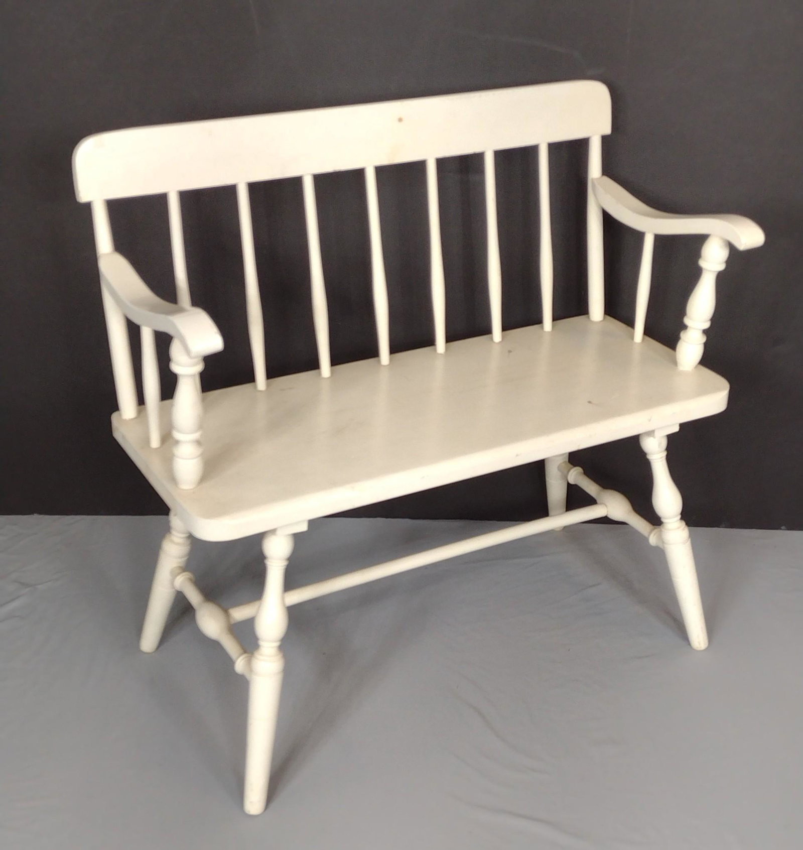 White Painted Bench: 35" wide X 14-1/2" deep X 33-1/4" high. Has some discoloring. MG. IMPORTANT: Before bidding, please read the terms and conditions. When you registered for the auction you agreed to these terms and wil
