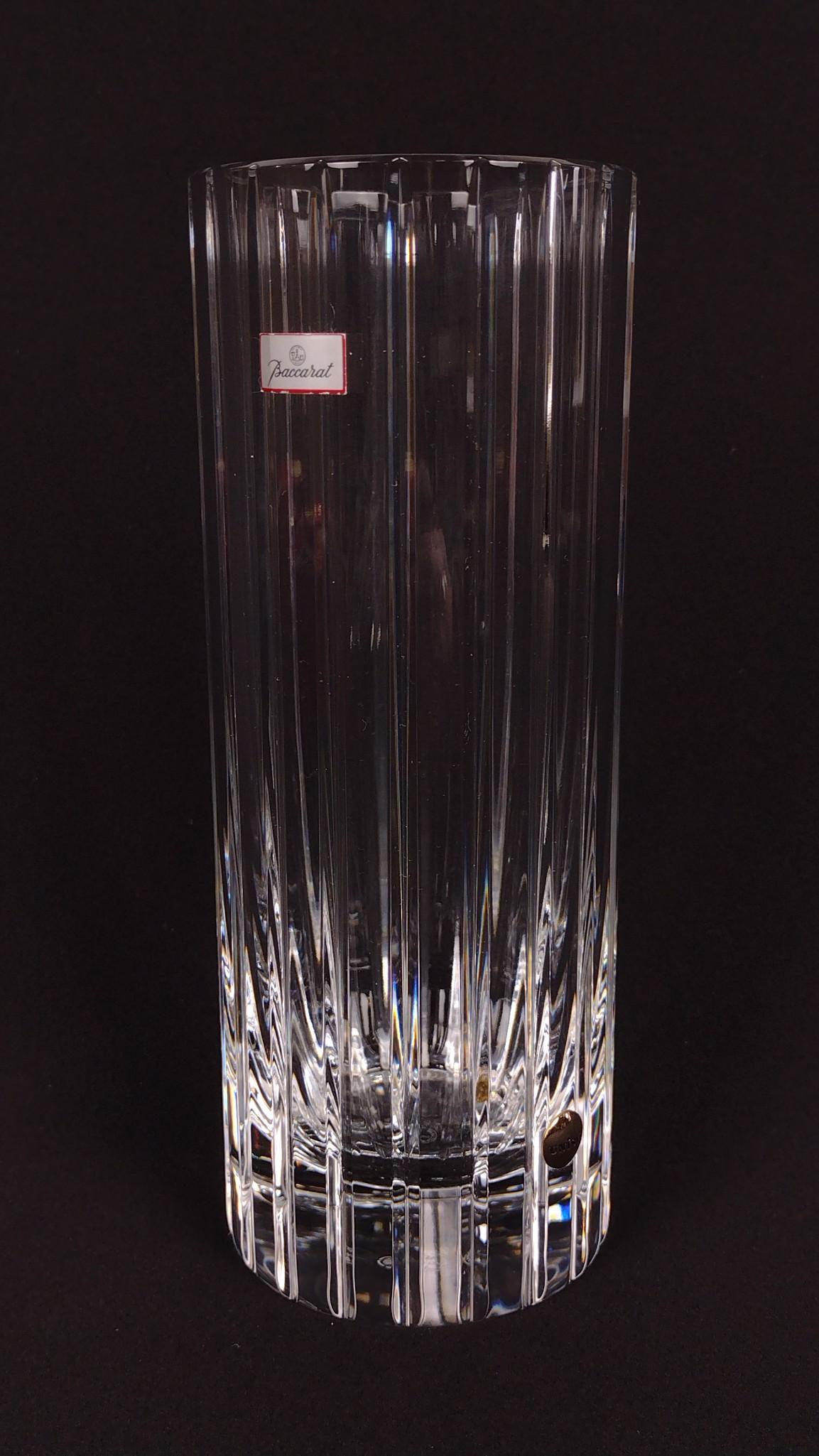 Baccarat Crystal Vase: With original box. 3" diameter X 7-3/4" high. DM IMPORTANT: Before bidding, please read the terms and conditions. When you registered for the auction you agreed to these terms and will be required to 