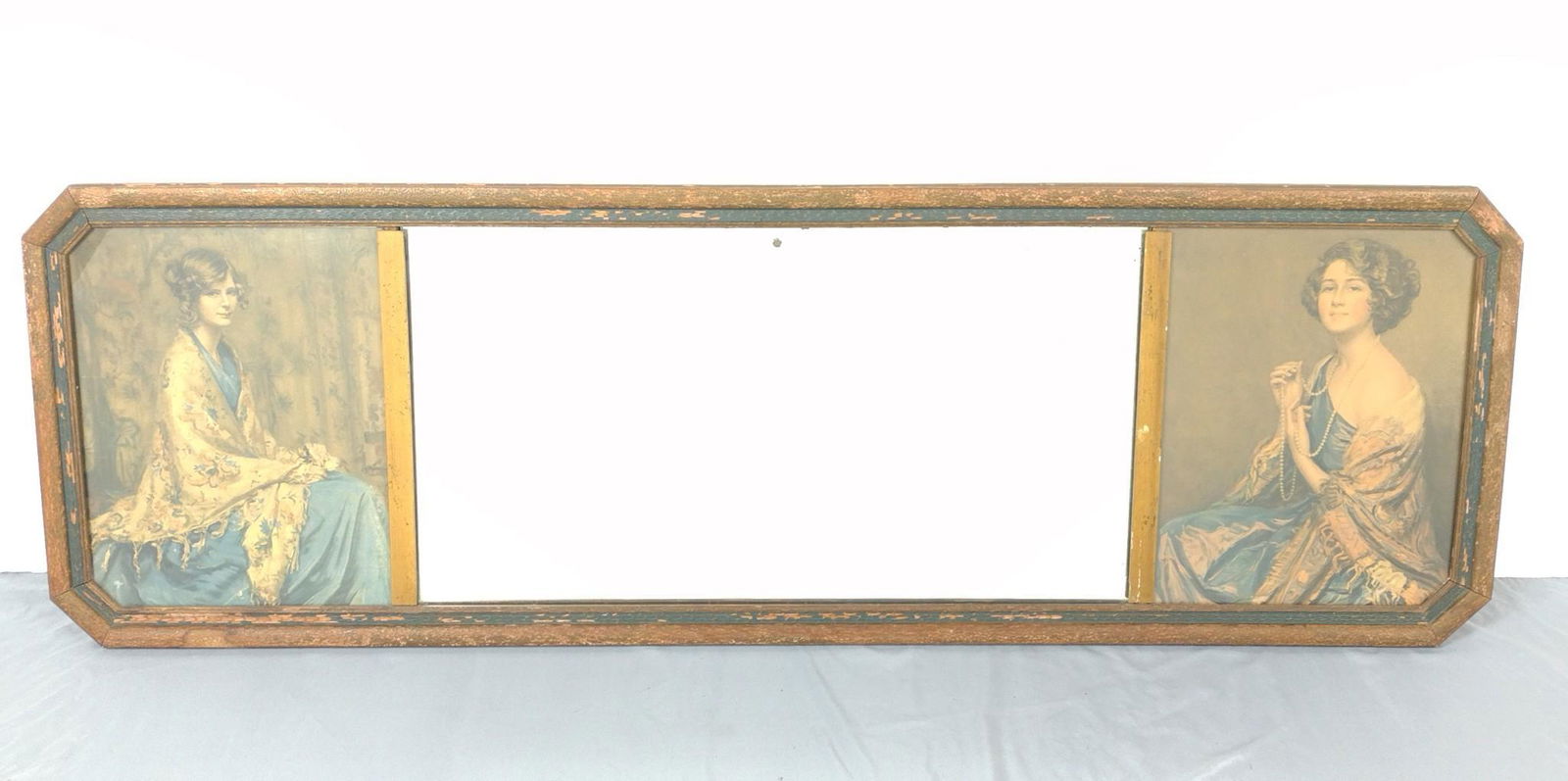 Vintage Mirror with Portrait Print Sides: 51-1/2" wide X 16-3/4" high. Mirror has loss in top center. Frame has paint loss. MG. IMPORTANT: Before bidding, please read the terms and conditions. When you registered for the auction you agreed to