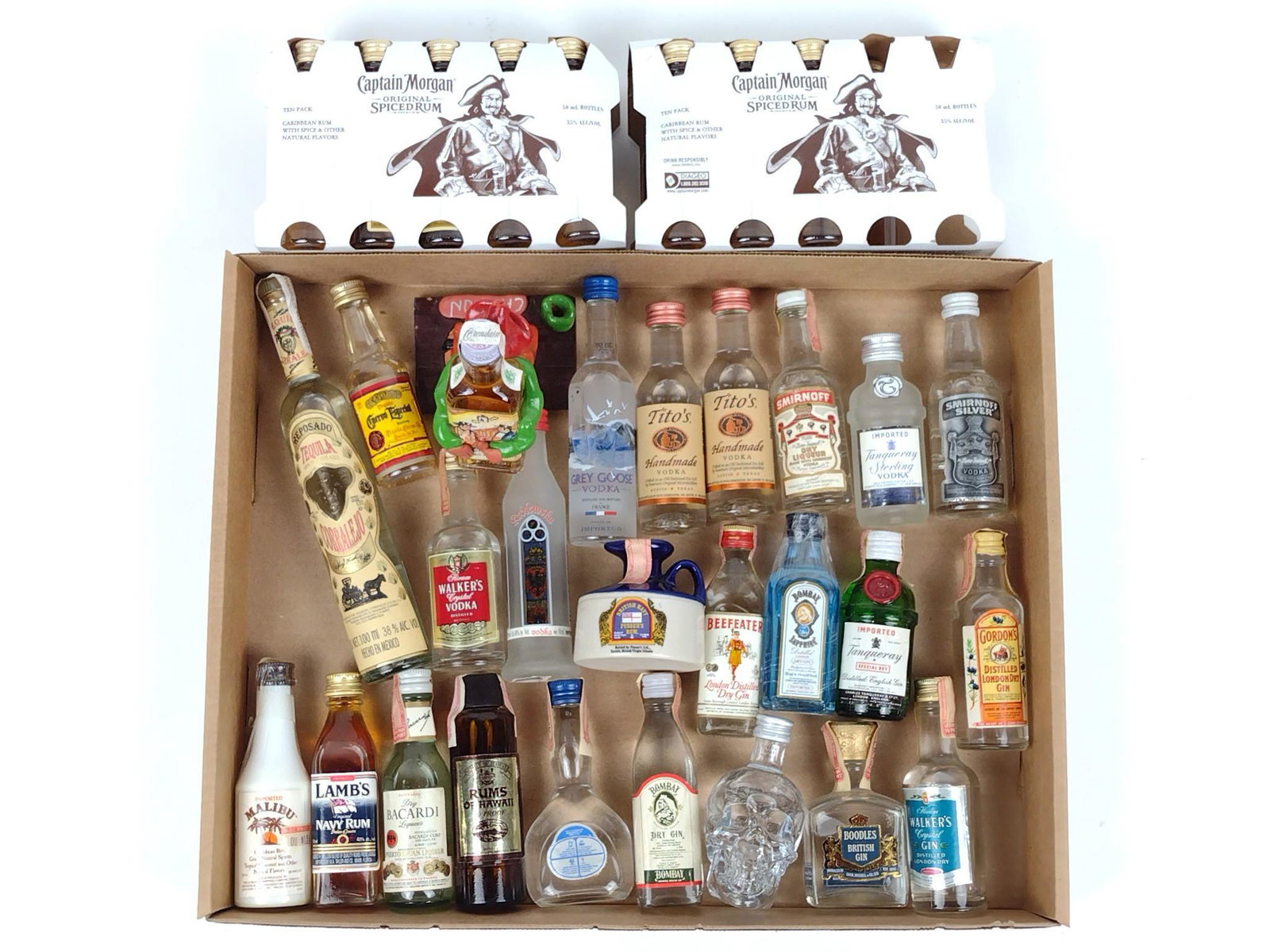 42 Miniature Bottles of Estate Vodka, Rum, Gin, & Tequila: All sealed and unopened. DP. This lot cannot be shipped. IMPORTANT: Before bidding, please read the terms and conditions. When you registered for the auction you agreed to these terms and will be requ