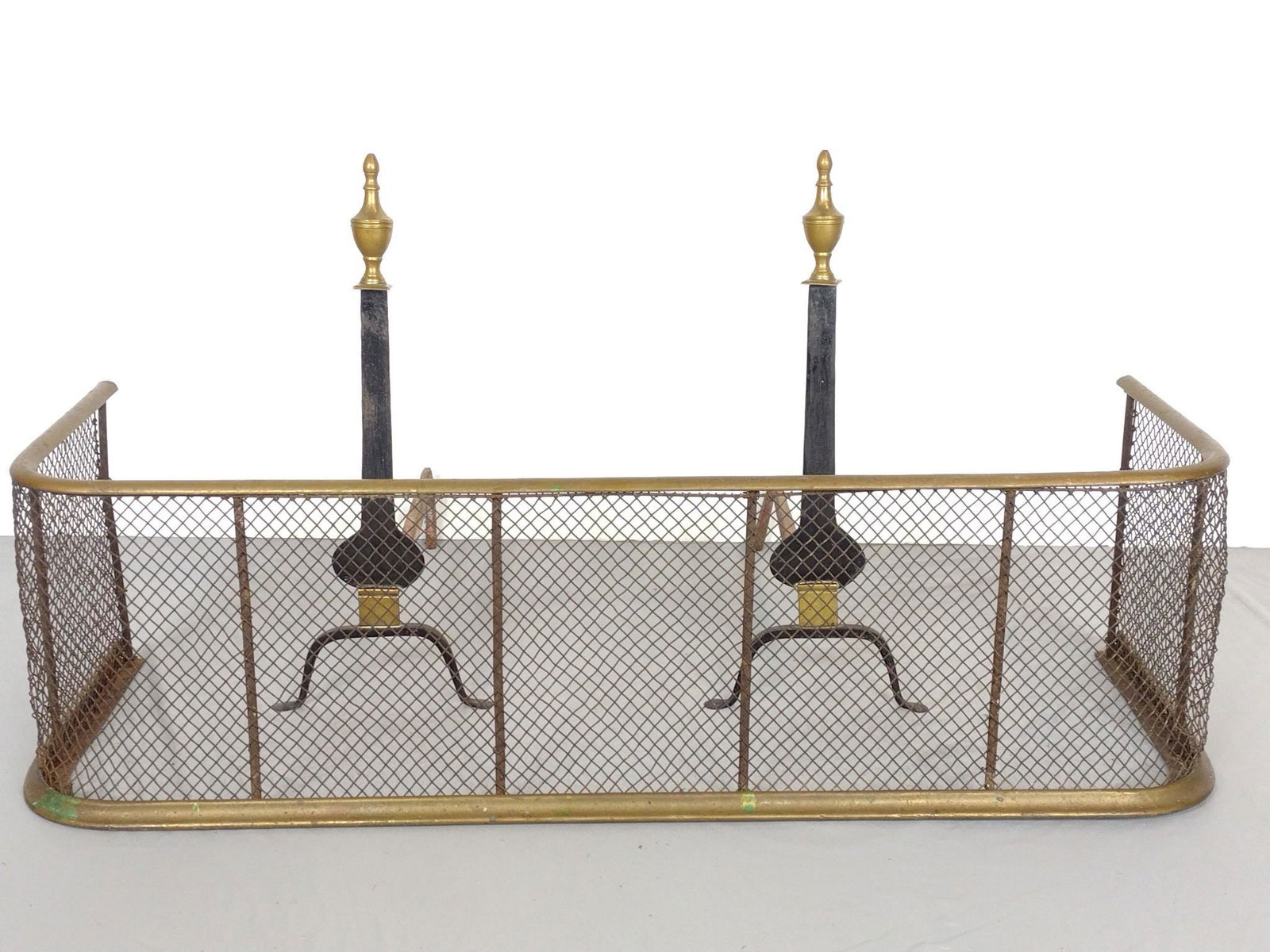 Black/Brass Andirons and Fire Fender: Andirons 8-1/2" wide X 18-1/2" deep X 21-1/2" high. Fire Fender 41" wide X 12-1/2" deep X 12" high. All Pcs have some discoloring and finish loss. MG. IMPORTANT: Before bidding, please read the terms