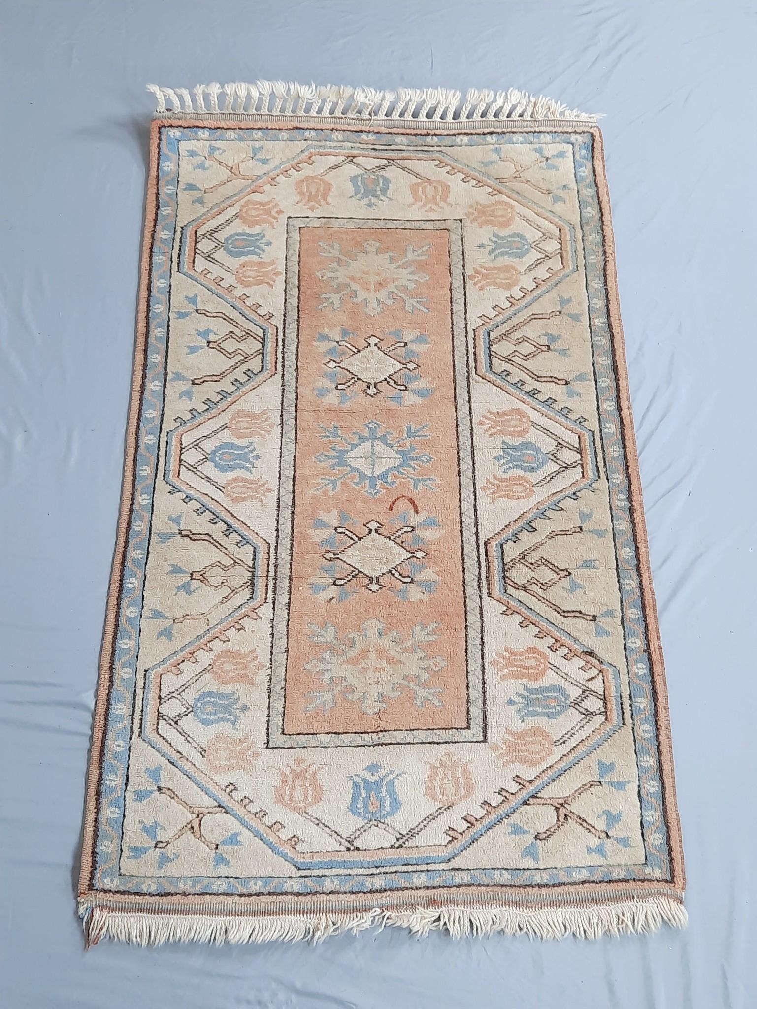 Turkish Kars Area Rug: Circa 1970s. Tribal design with peach, blue and cream highlights. 4' 5" long x 2' 8" wide. LR IMPORTANT: Before bidding, please read the terms and conditions. When you registered for the auc