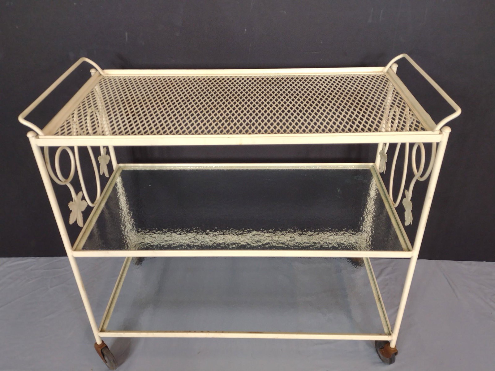 Metal Outdoor Tea Cart: 15-1/4" wide X 32-3/4" deep X 30" high. Has some minor areas of paint loss. Wheel brackets have rust. MG. IMPORTANT: Before bidding, please read the terms and conditions. When you registered for the a