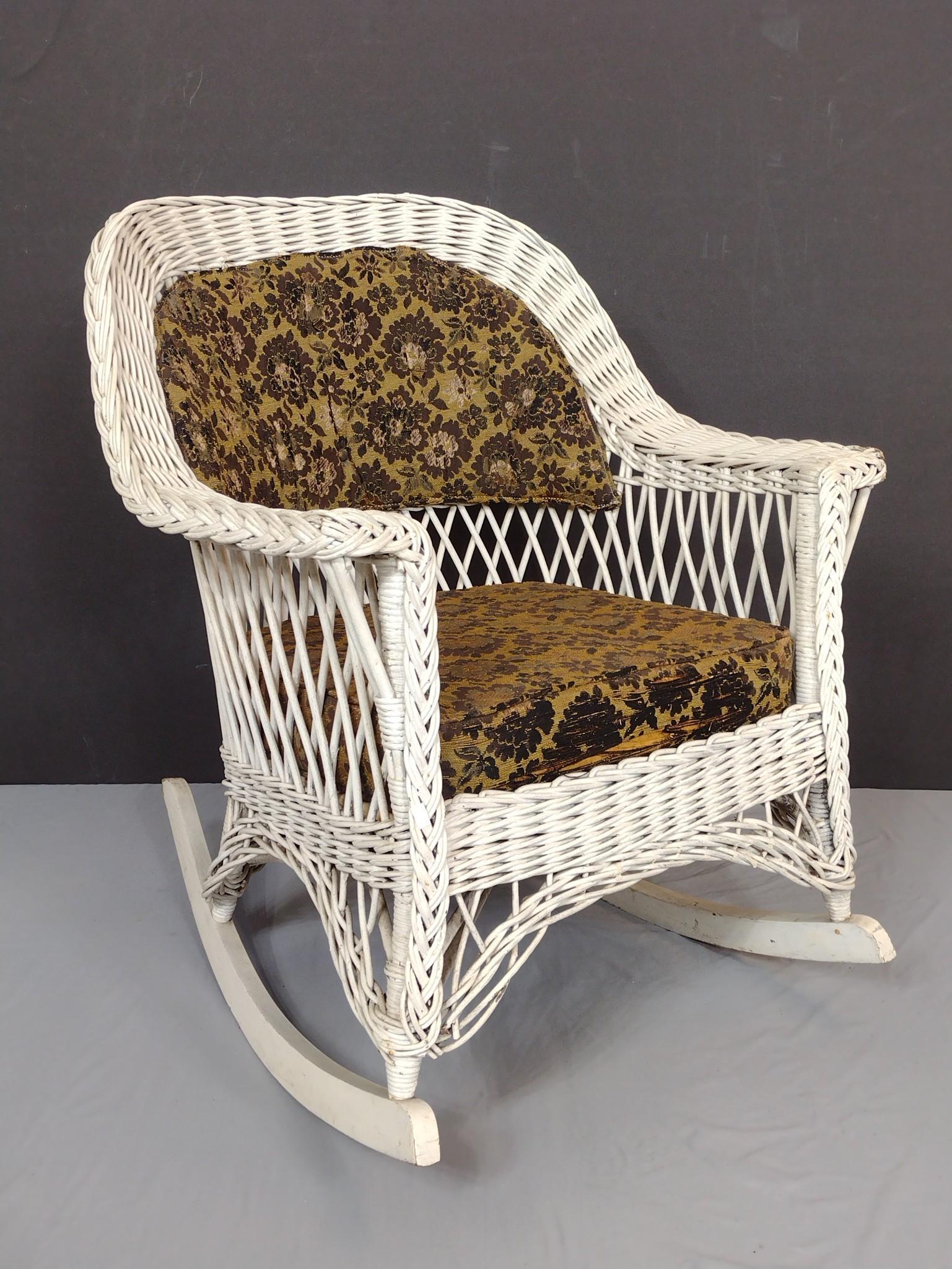 Wicker Rocker: 28" wide X 32" deep X 34" high. Has some paint loss. MG. IMPORTANT: Before bidding, please read the terms and conditions. When you registered for the auction you agreed to these terms and will be requ