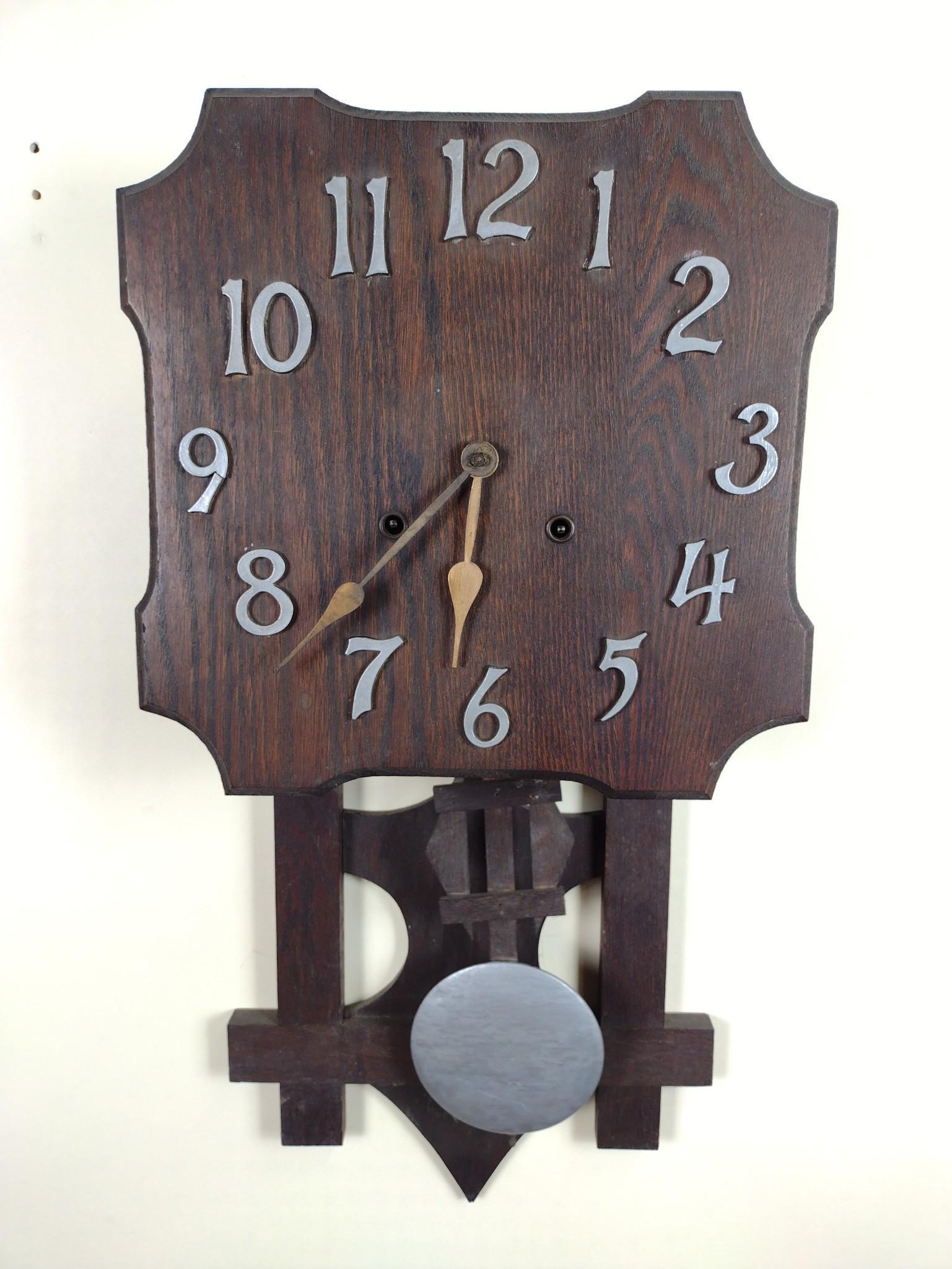 Vintage Wall Clock: Starts and stops. 13" wide X 25" high. DM IMPORTANT: Before bidding, please read the terms and conditions. When you registered for the auction you agreed to these terms and will be required to comply