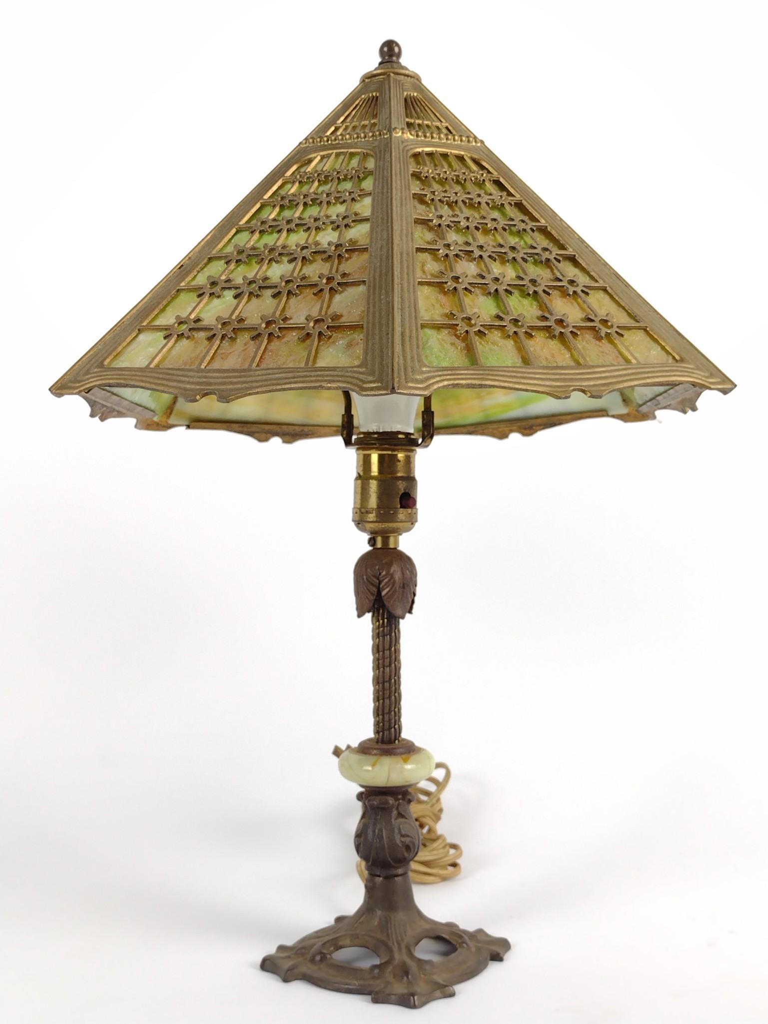 Slag Glass Table Lamp: Working. 19" high. Shade 12-1/2" wide. 2 slag panels cracked. DM IMPORTANT: Before bidding, please read the terms and conditions. When you registered for the auction you agreed to these terms and will